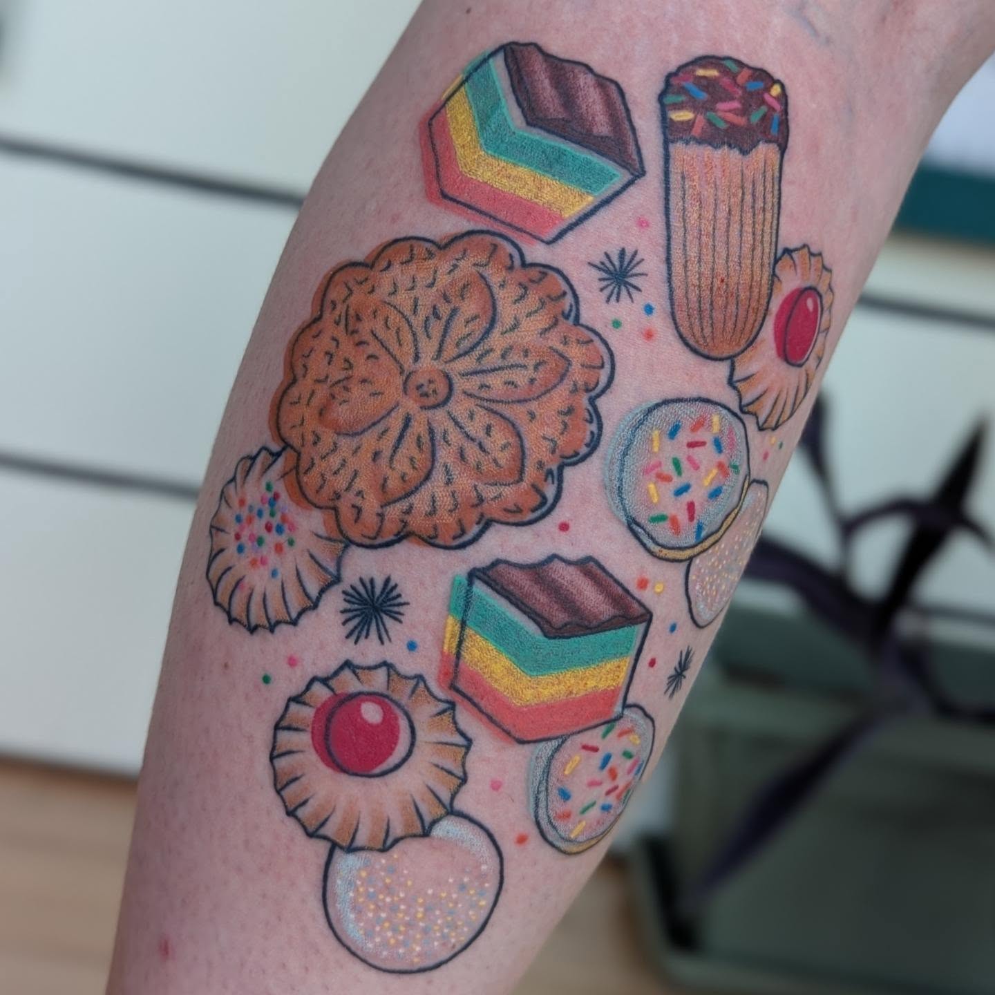 Sweet treats new school tattoo on the forearm by Angie Meuth