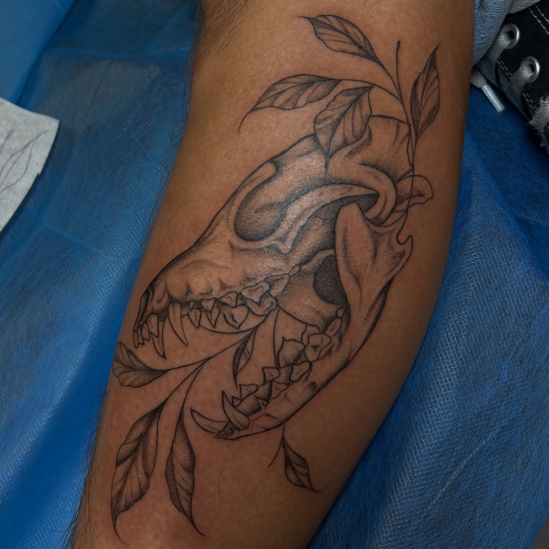Skull and leaves realism tattoo on the forearm by Sydney Gallucci