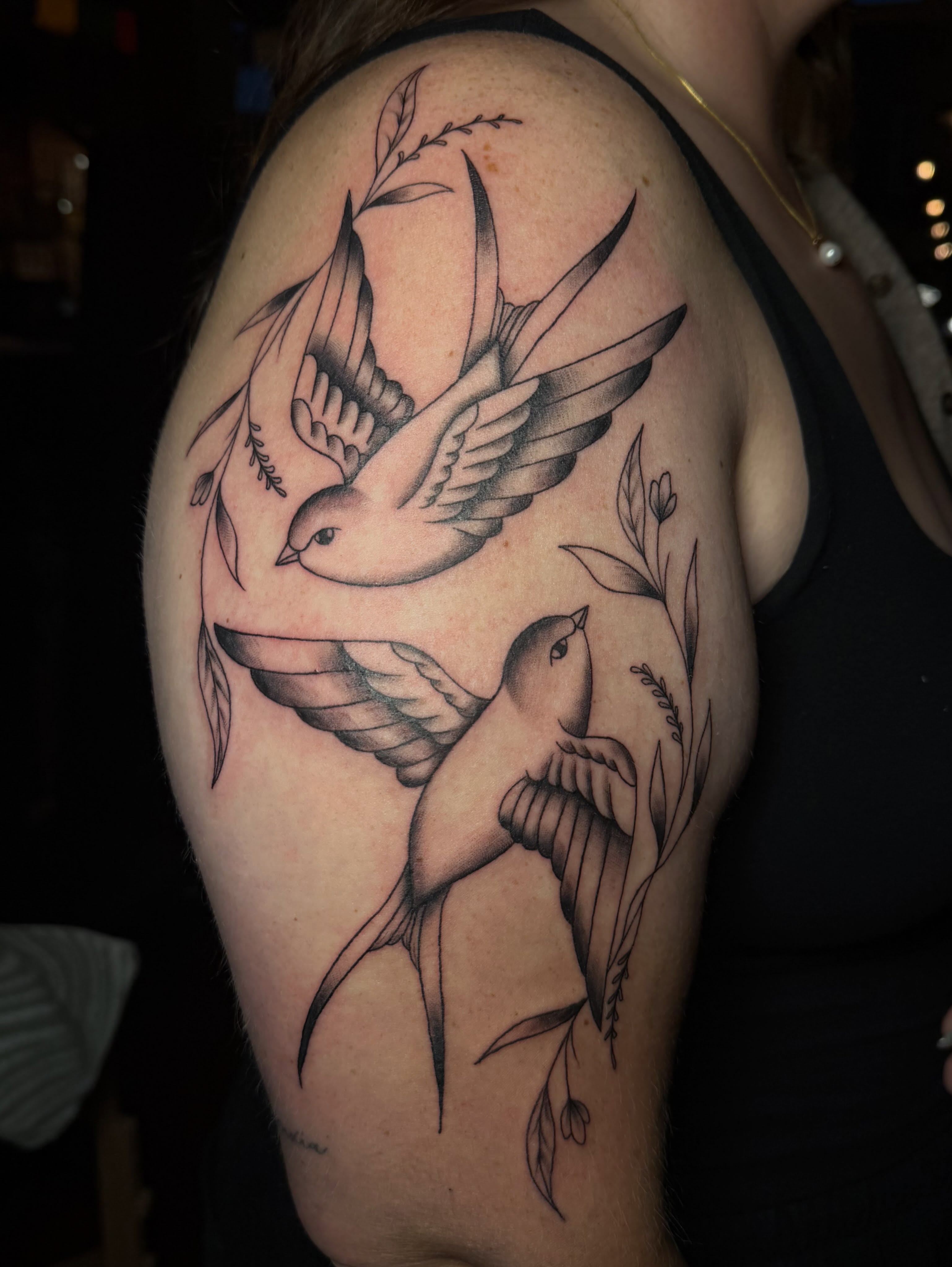 Birds and floral elements black and grey tattoo on the shoulder by Alaska ⚜️