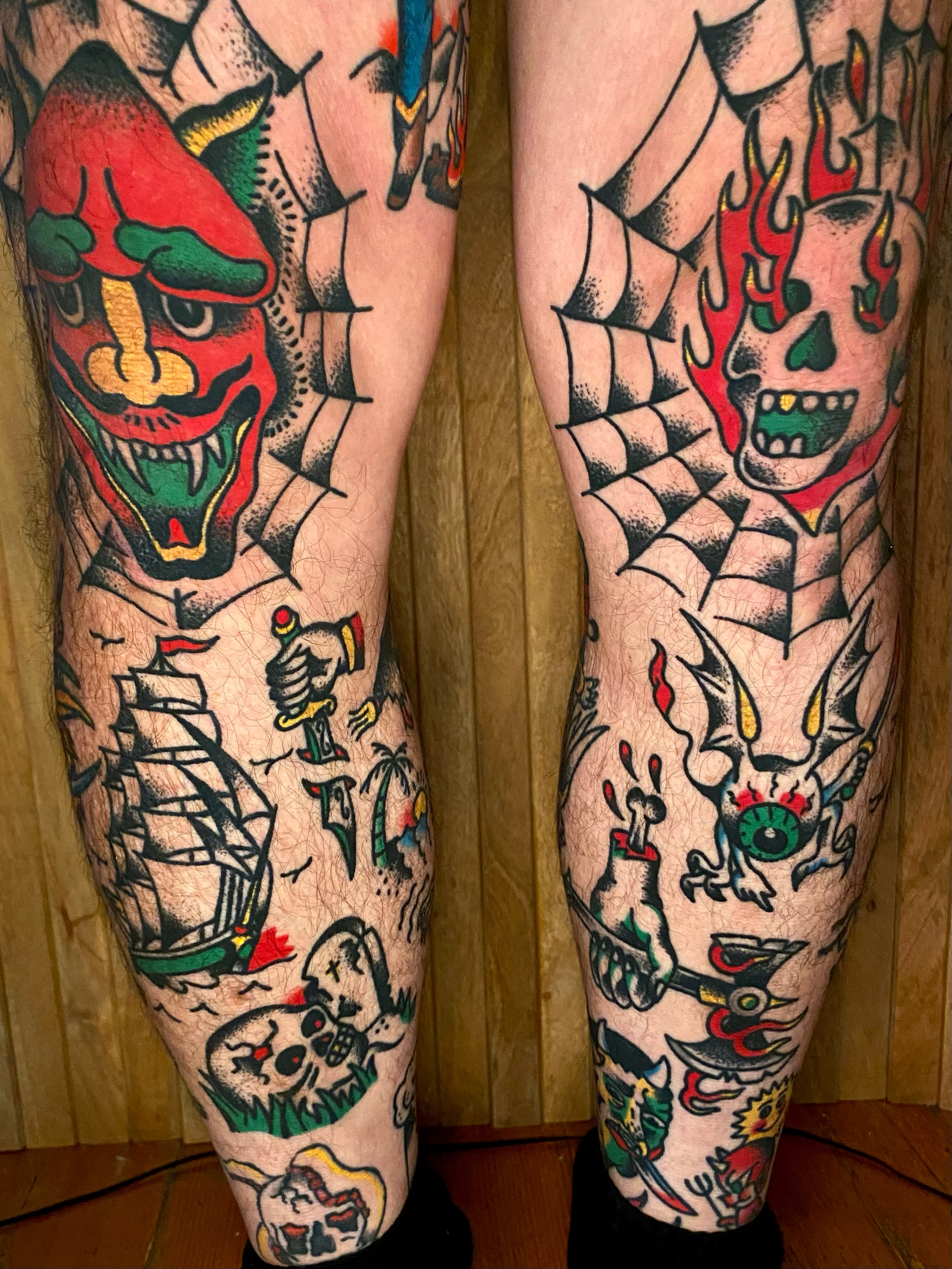 Japanese mask and ship American traditional tattoo on the leg by Daniel Diego