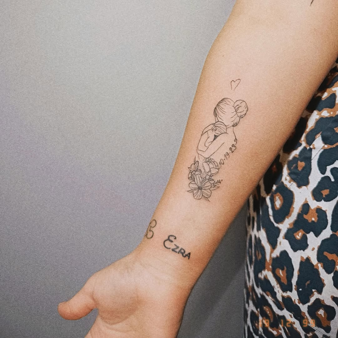 Woman with flowers fine line tattoo on the forearm by Ashlee Burkey