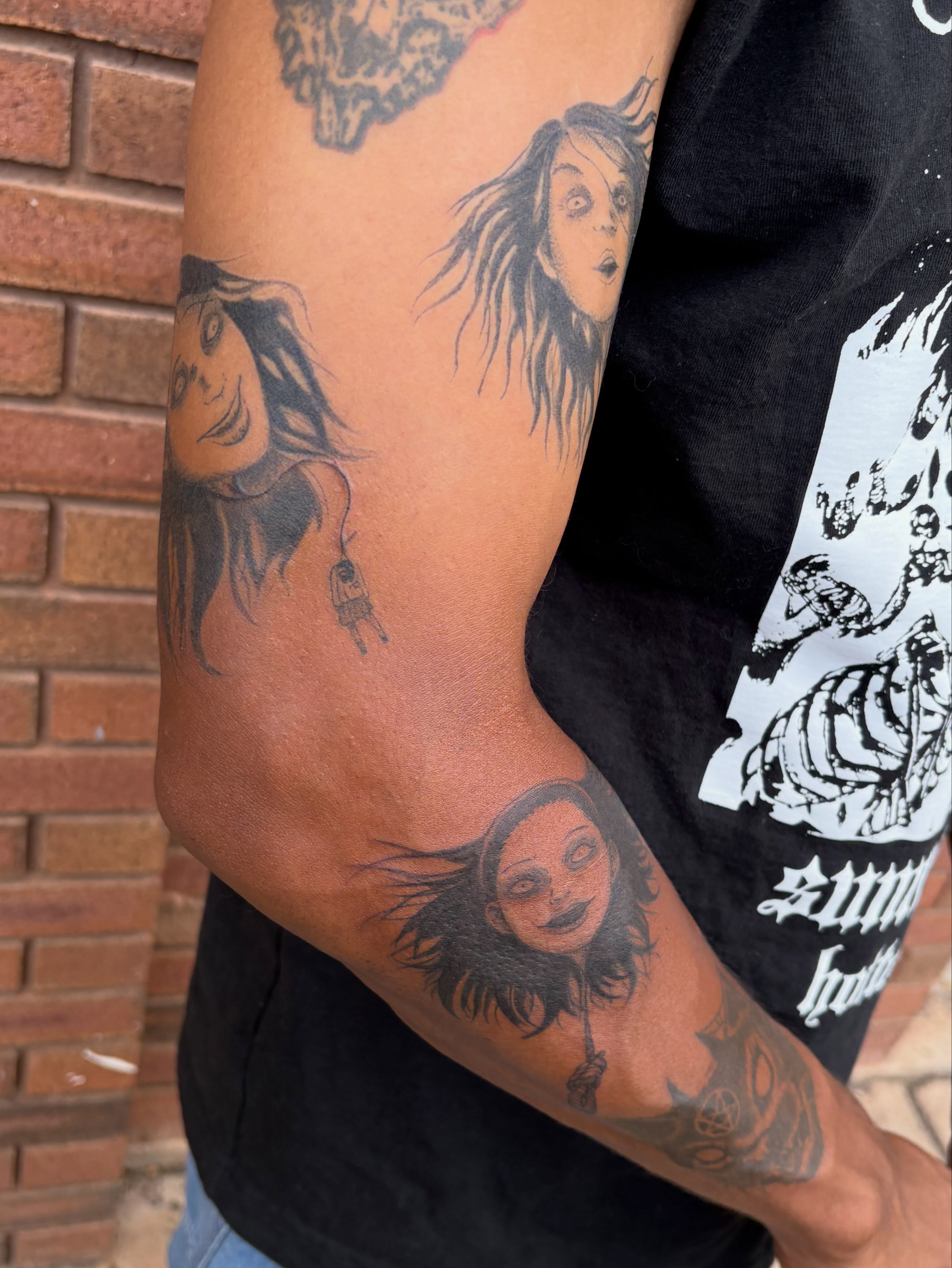 Woman black and grey tattoo on the forearm by Sierra Maynard