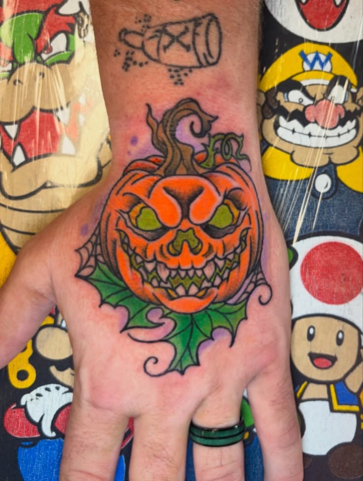 Pumpkin American traditional tattoo on the hand by Las Vegas Tattoo Artist, Las Vegas, Nevada
