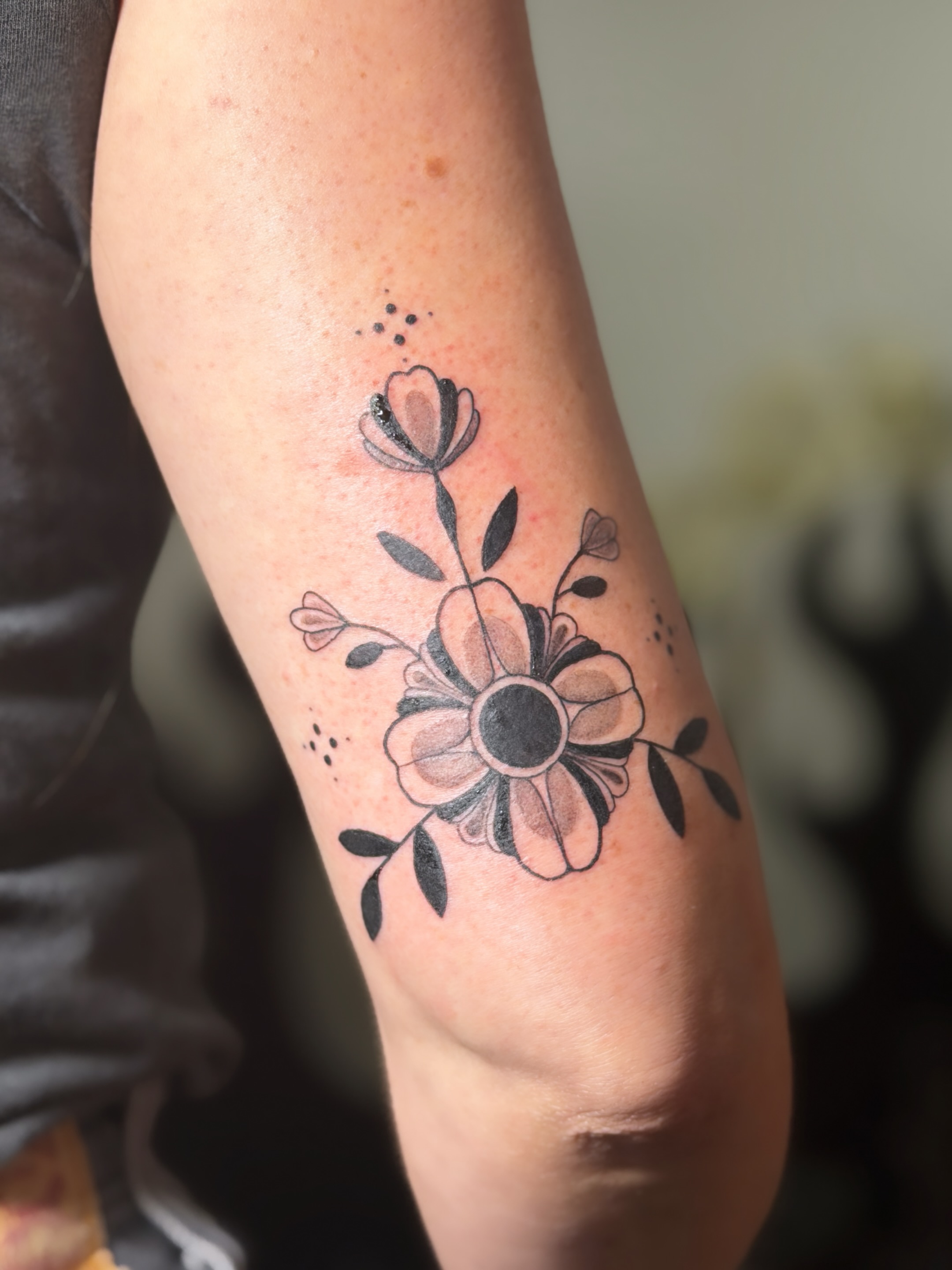 Flower dotwork tattoo on the forearm by Hayley Thomas