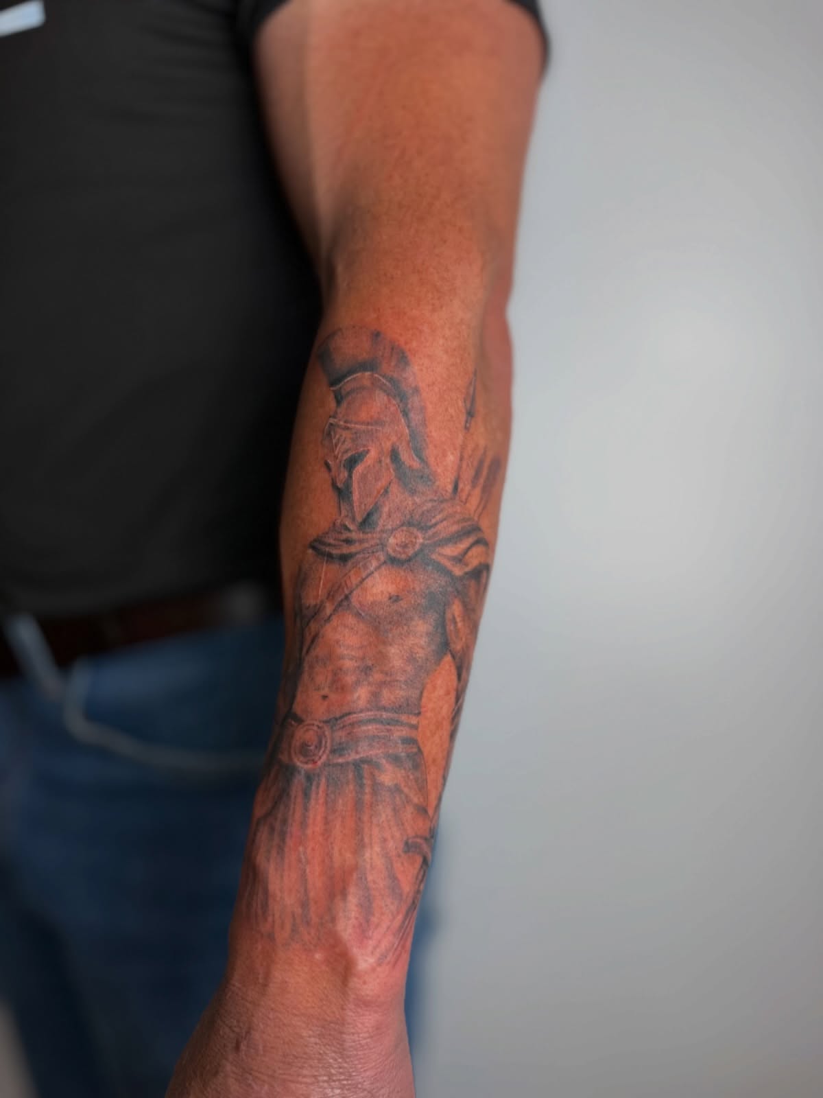 Spartan warrior realism tattoo on the forearm by Mackenzie