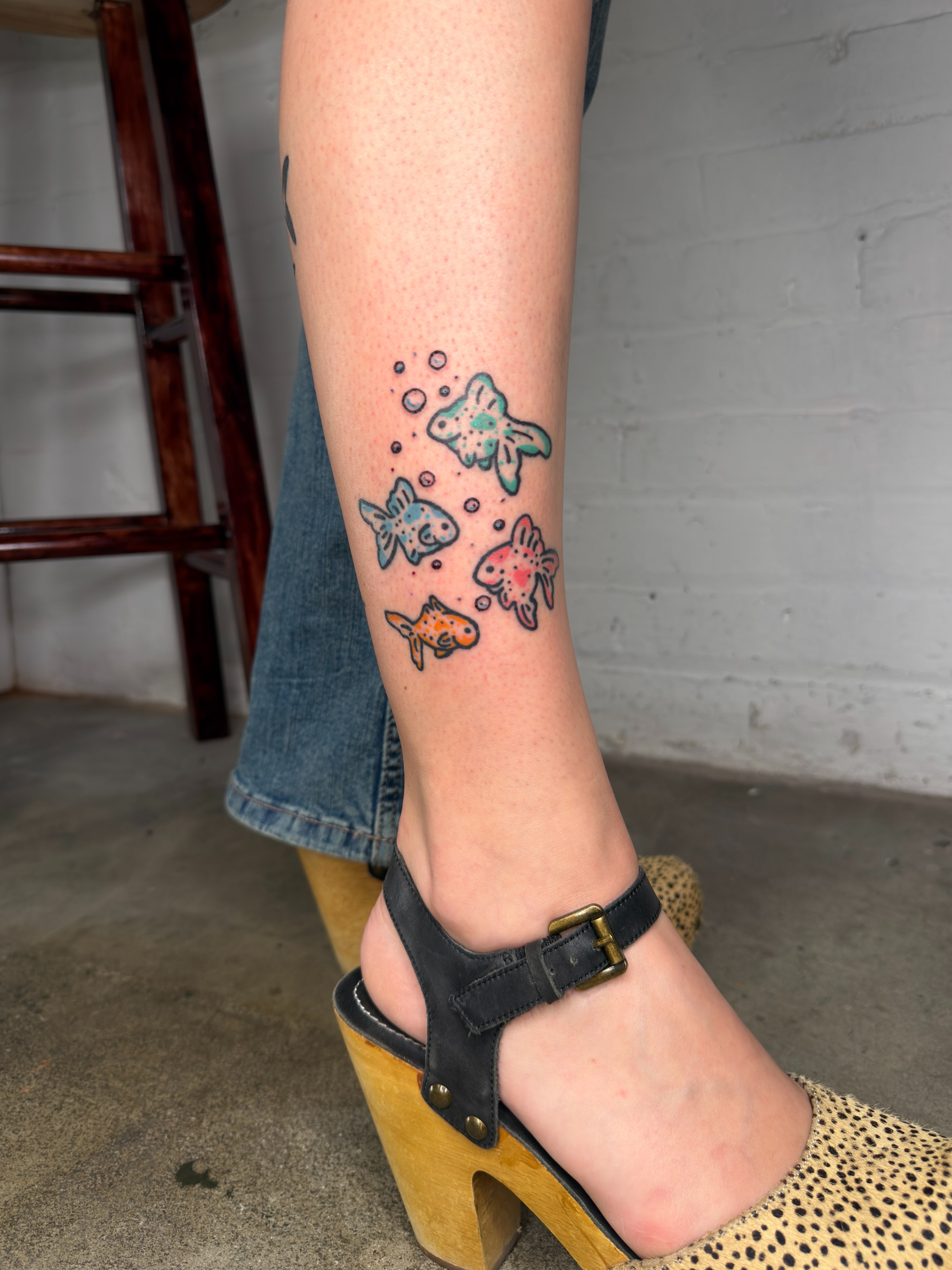 Fish dotwork tattoo on the calf by Dennis Patterson