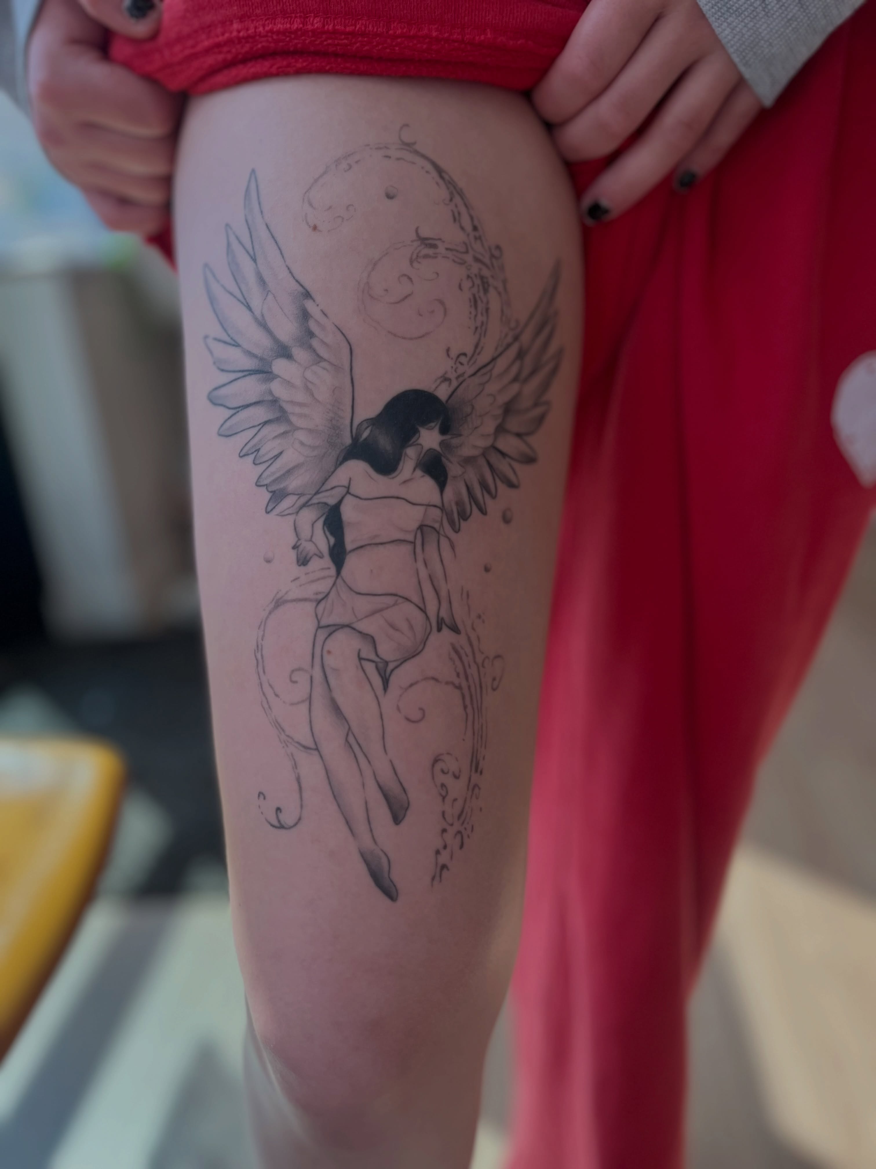 Angel black and grey tattoo on the thigh by Lexi Ross