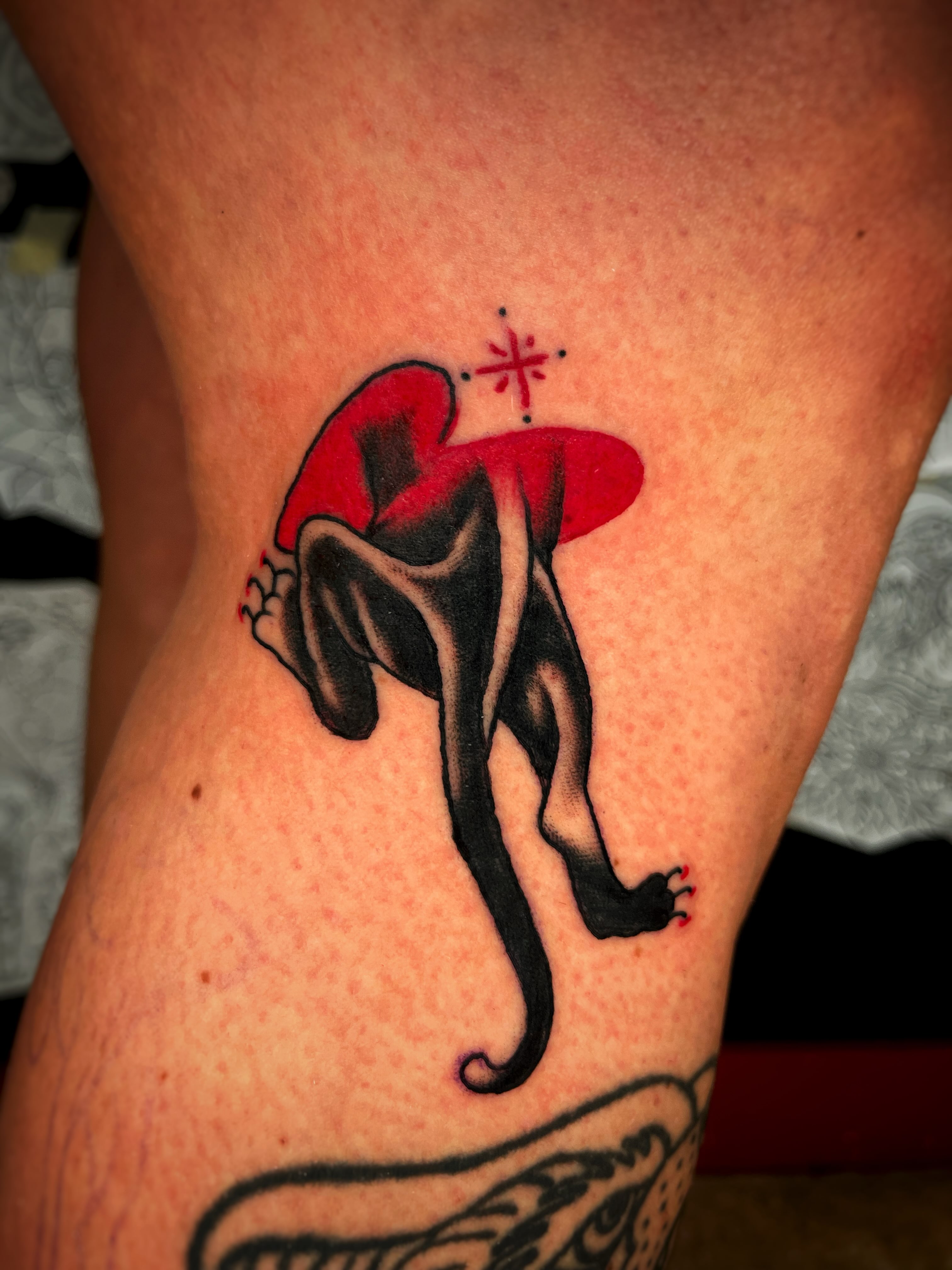 Cat silhouette dotwork tattoo on the thigh by Gilbert Gonzalez