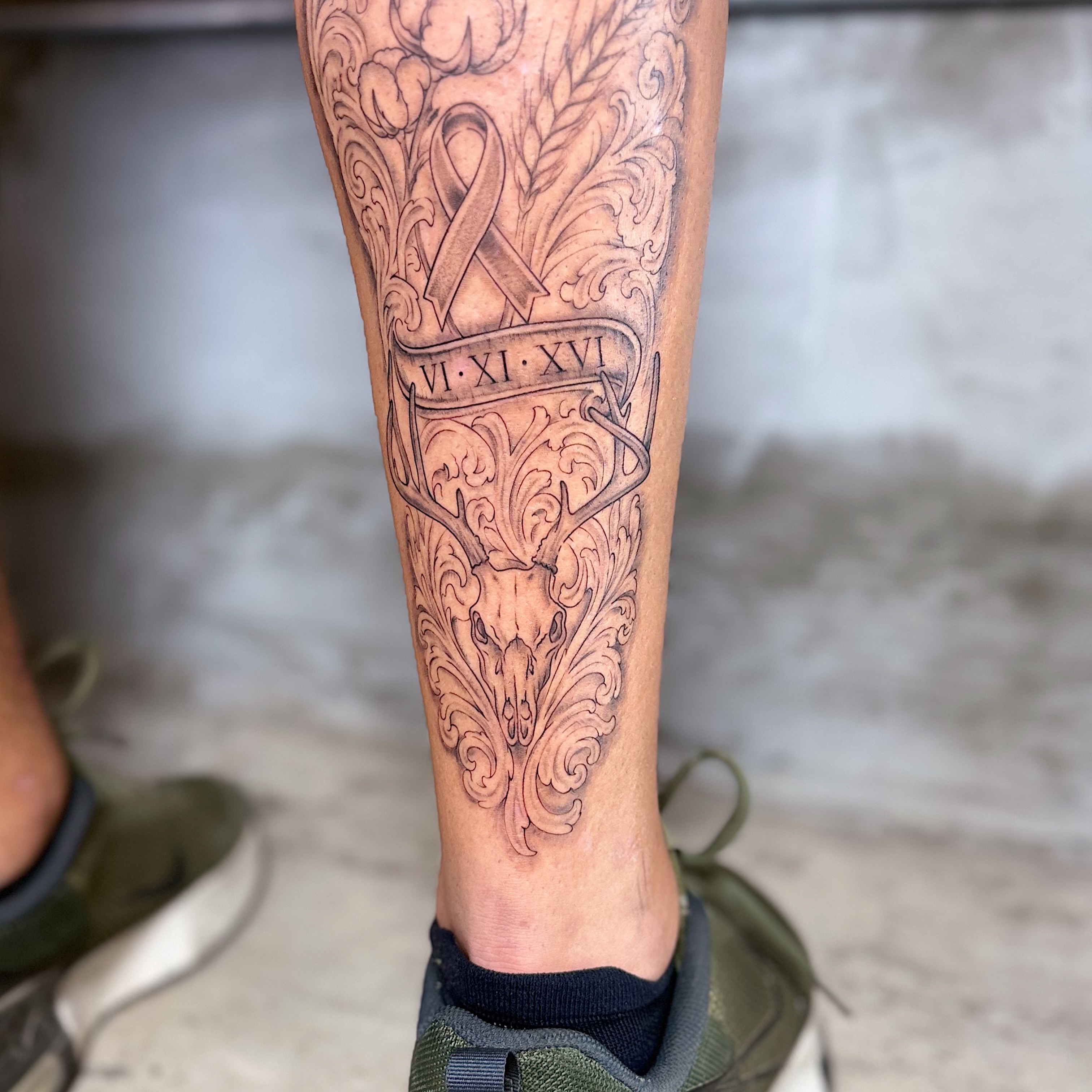Antlers and skull ornamental tattoo on the calf by INK with Christian, Mineral Wells, Texas