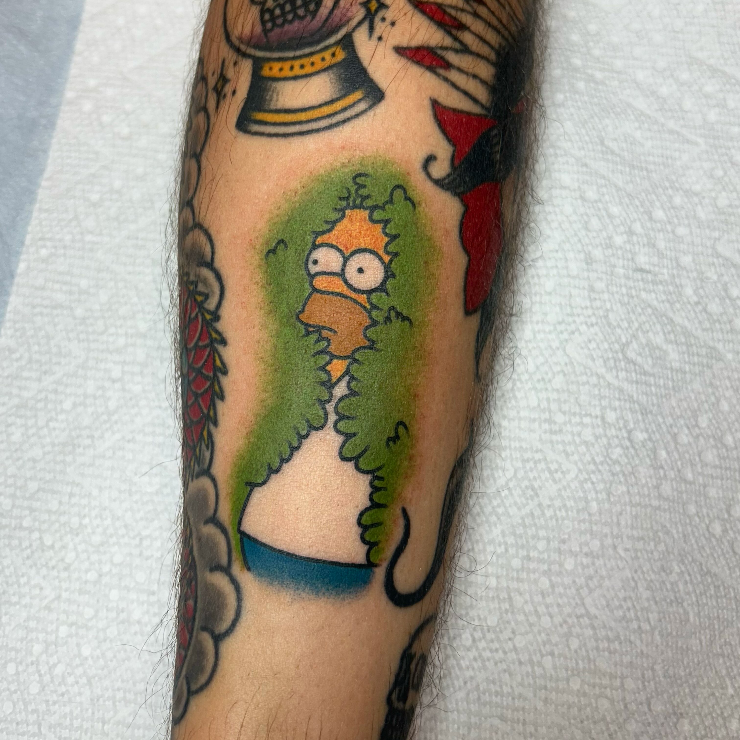 Homer simpson American traditional tattoo on the forearm by Stephen Sanchez