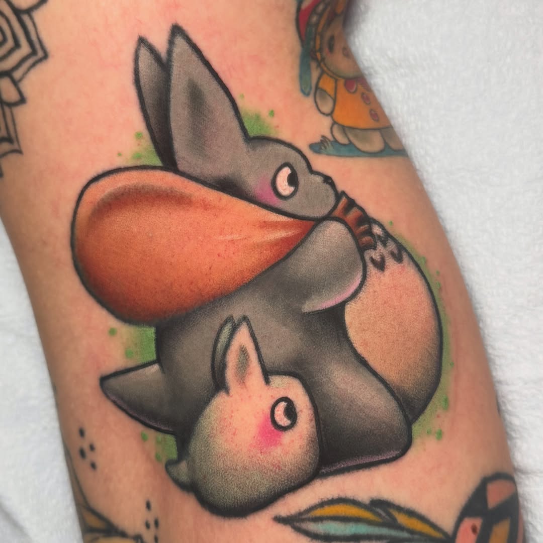 Rabbit and carrot American traditional tattoo on the forearm by Kayla Warren