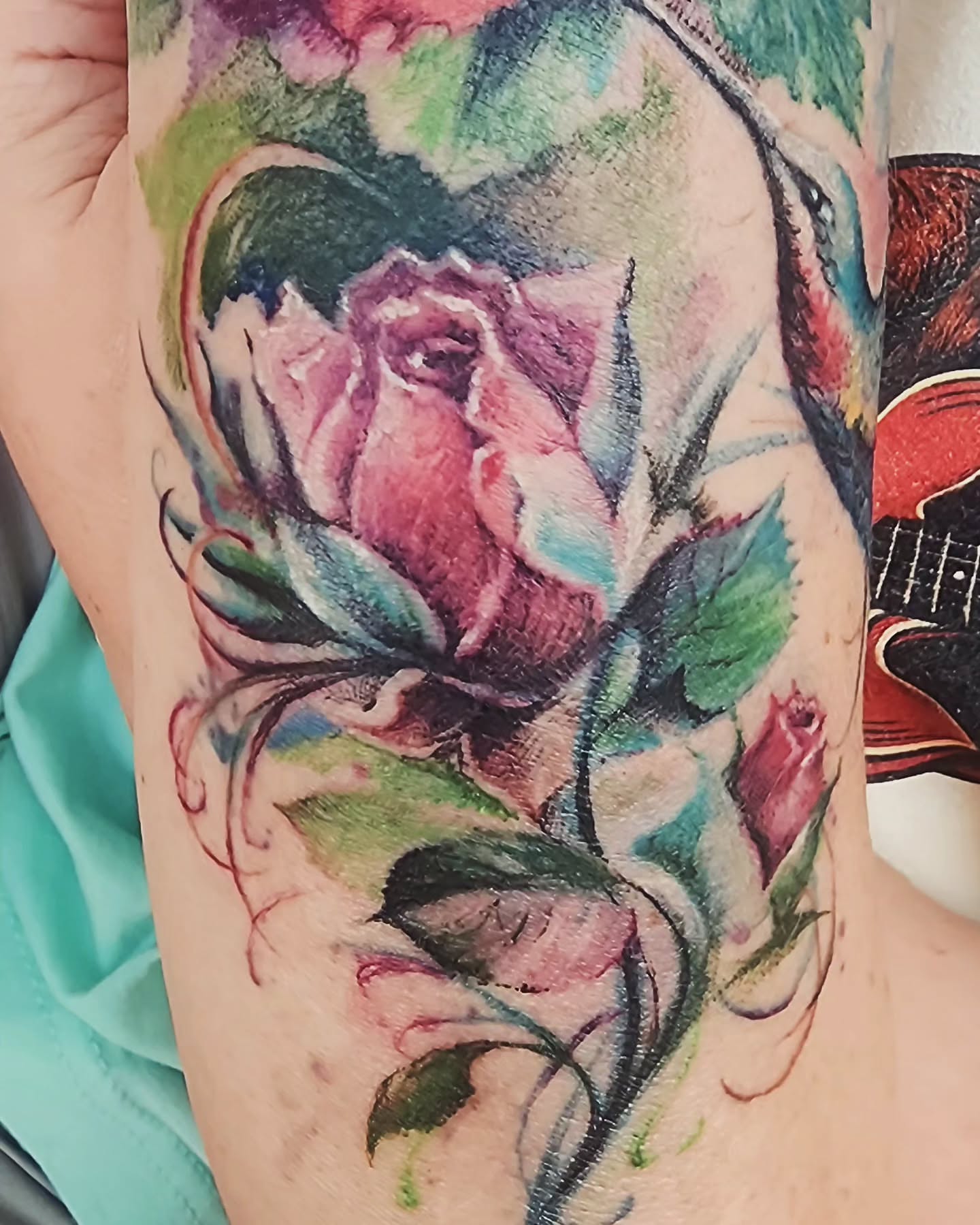 Watercolor rose watercolor tattoo on the forearm by Dr. Valerio Vegas Tattoo