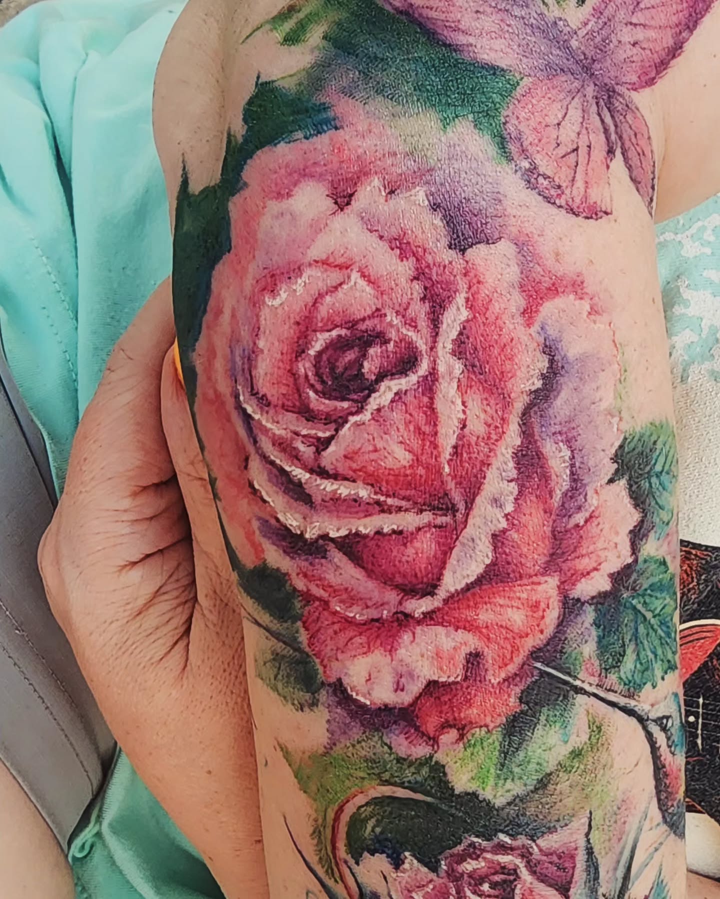 Watercolor rose watercolor tattoo on the forearm by Dr. Valerio Vegas Tattoo