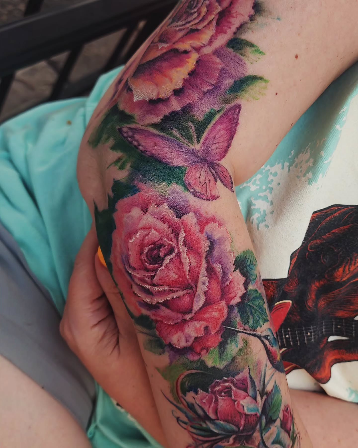 Roses and butterfly realism tattoo on the forearm by Dr. Valerio Vegas Tattoo