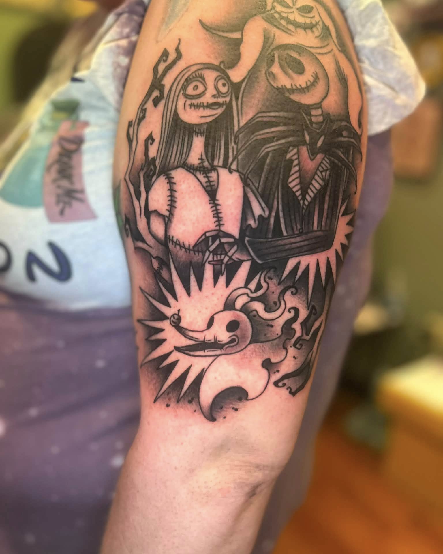 Jack Skellington and Sally dark realism tattoo on the forearm by Daemion