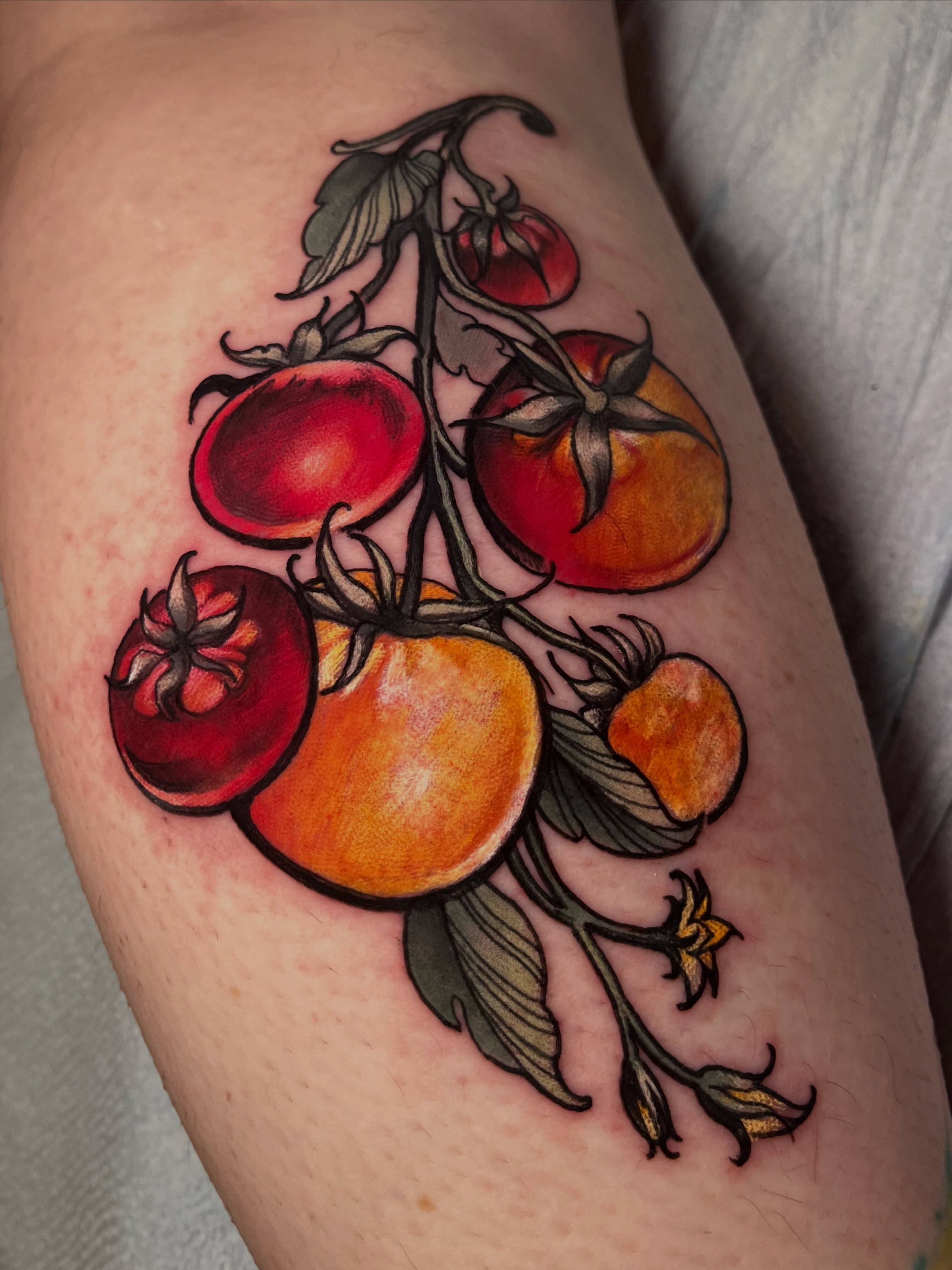 Tomatoes realism tattoo on the thigh by Cami Rose
