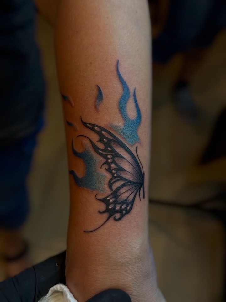 Butterfly dotwork tattoo on the forearm by Winston Thai