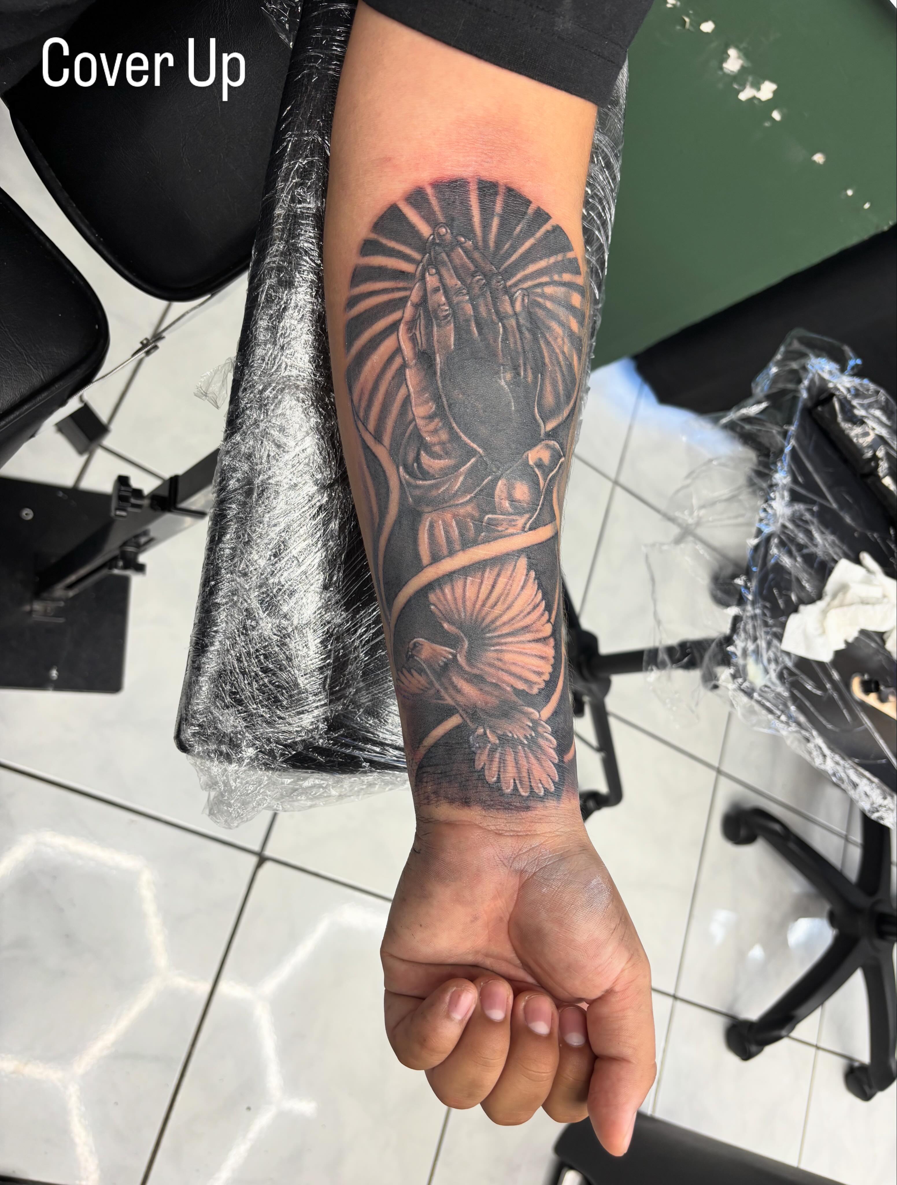 Praying hands realism tattoo on the forearm by Shadows Tattoos