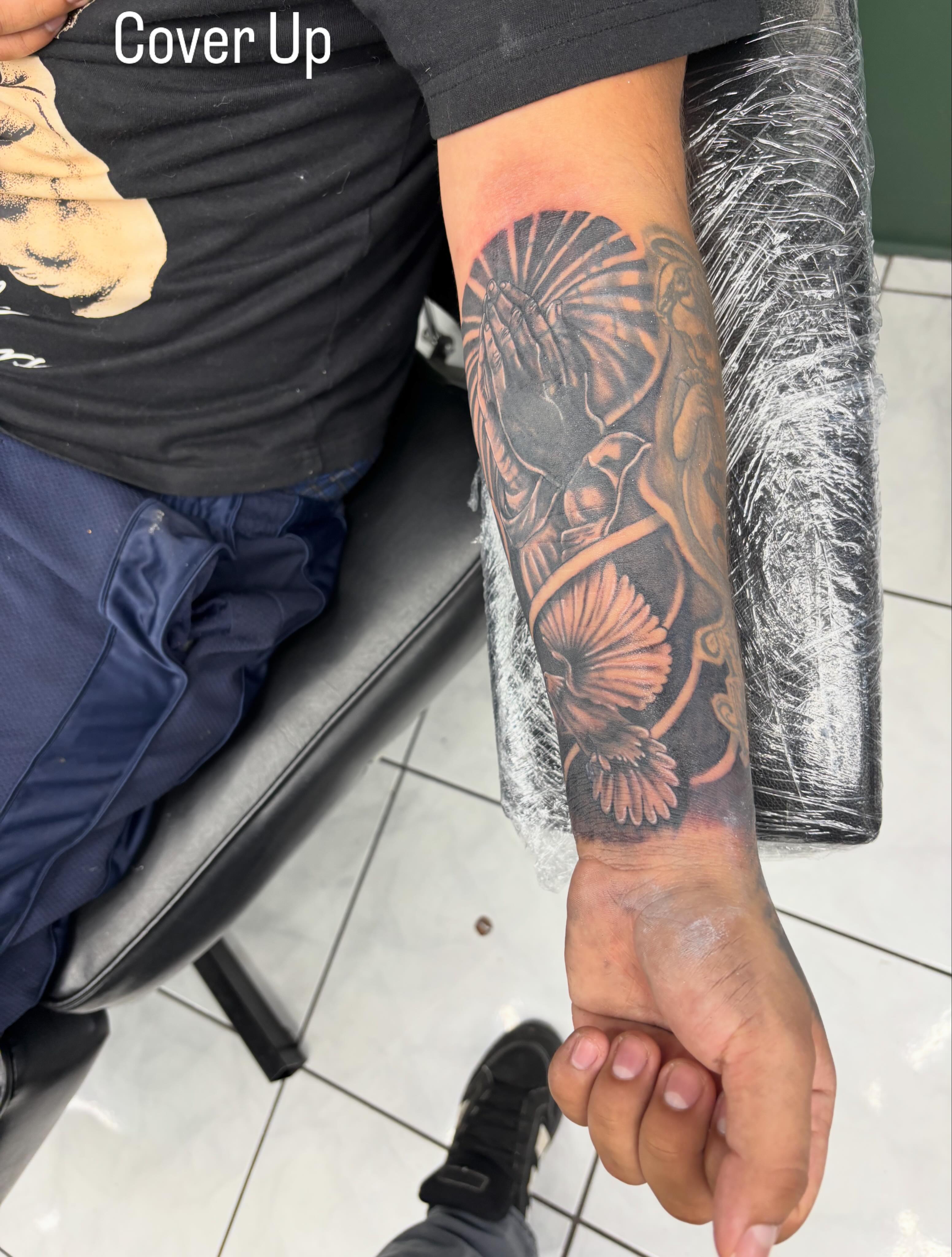 Floral arrangement black and grey tattoo on the forearm by Shadows Tattoos