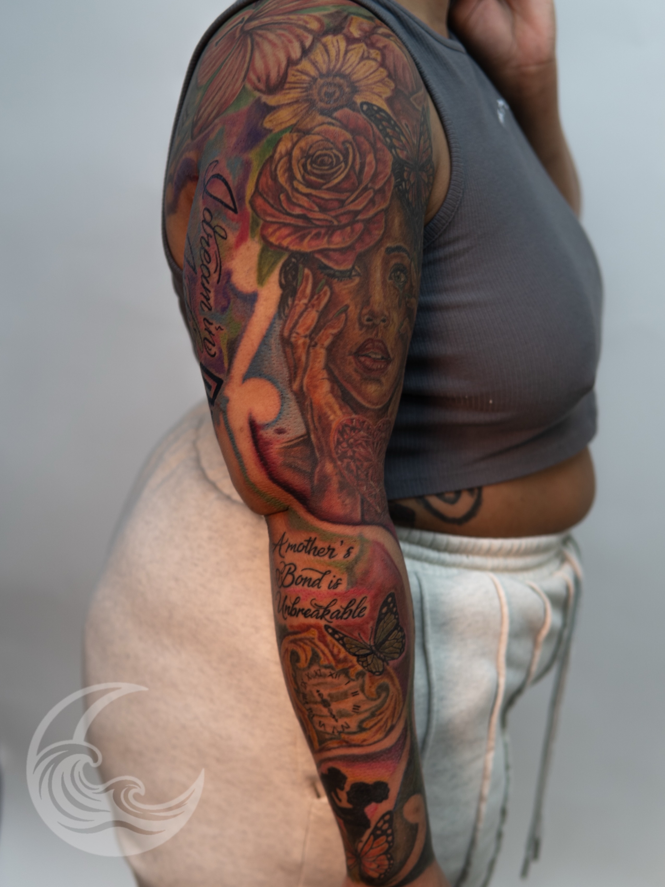 Mother and child realism tattoo on the upper arm by Justin custard Tattoo💉Artist 🎨Painter