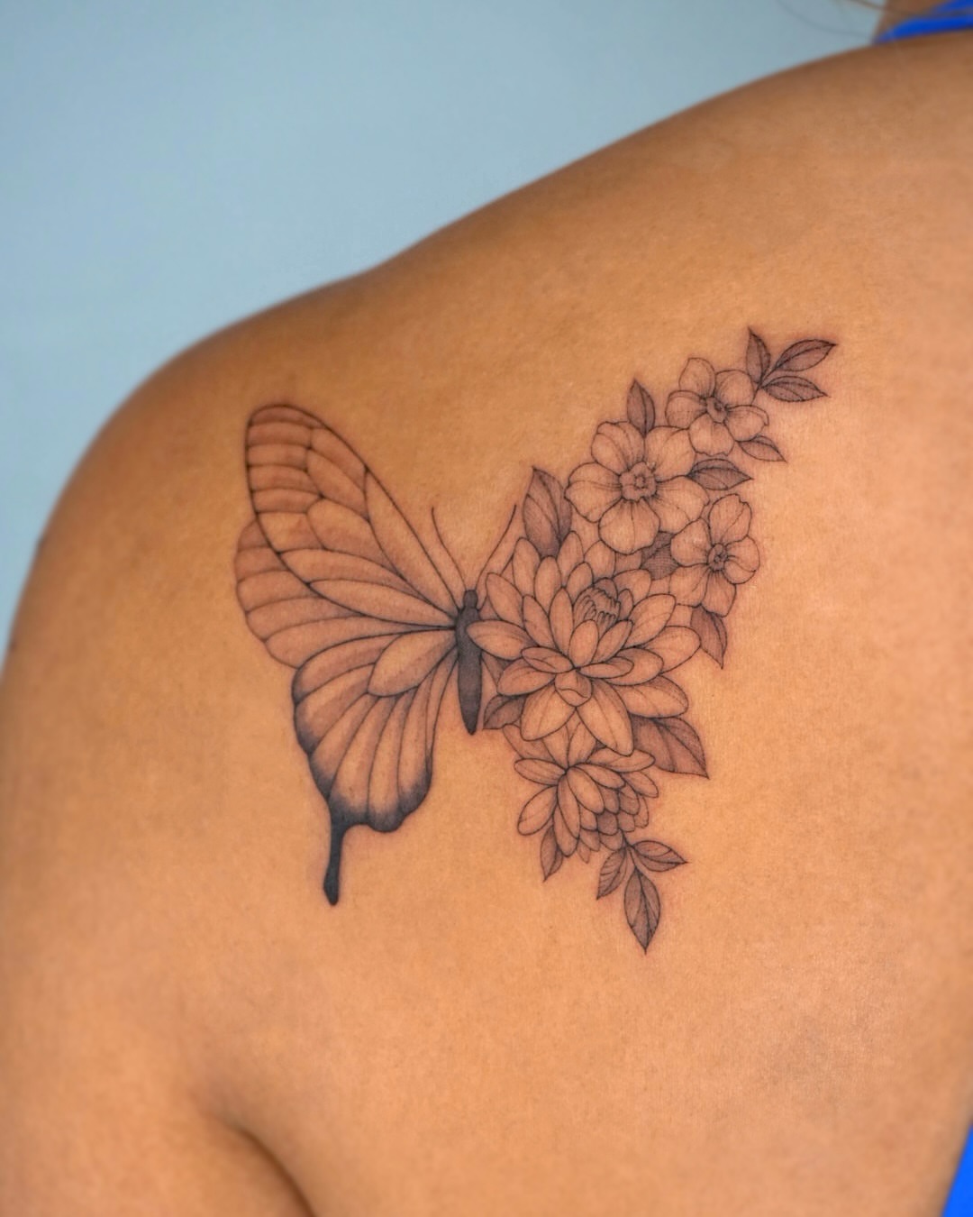 Butterfly and flowers black and grey tattoo on the shoulder by Hyn[hin]
