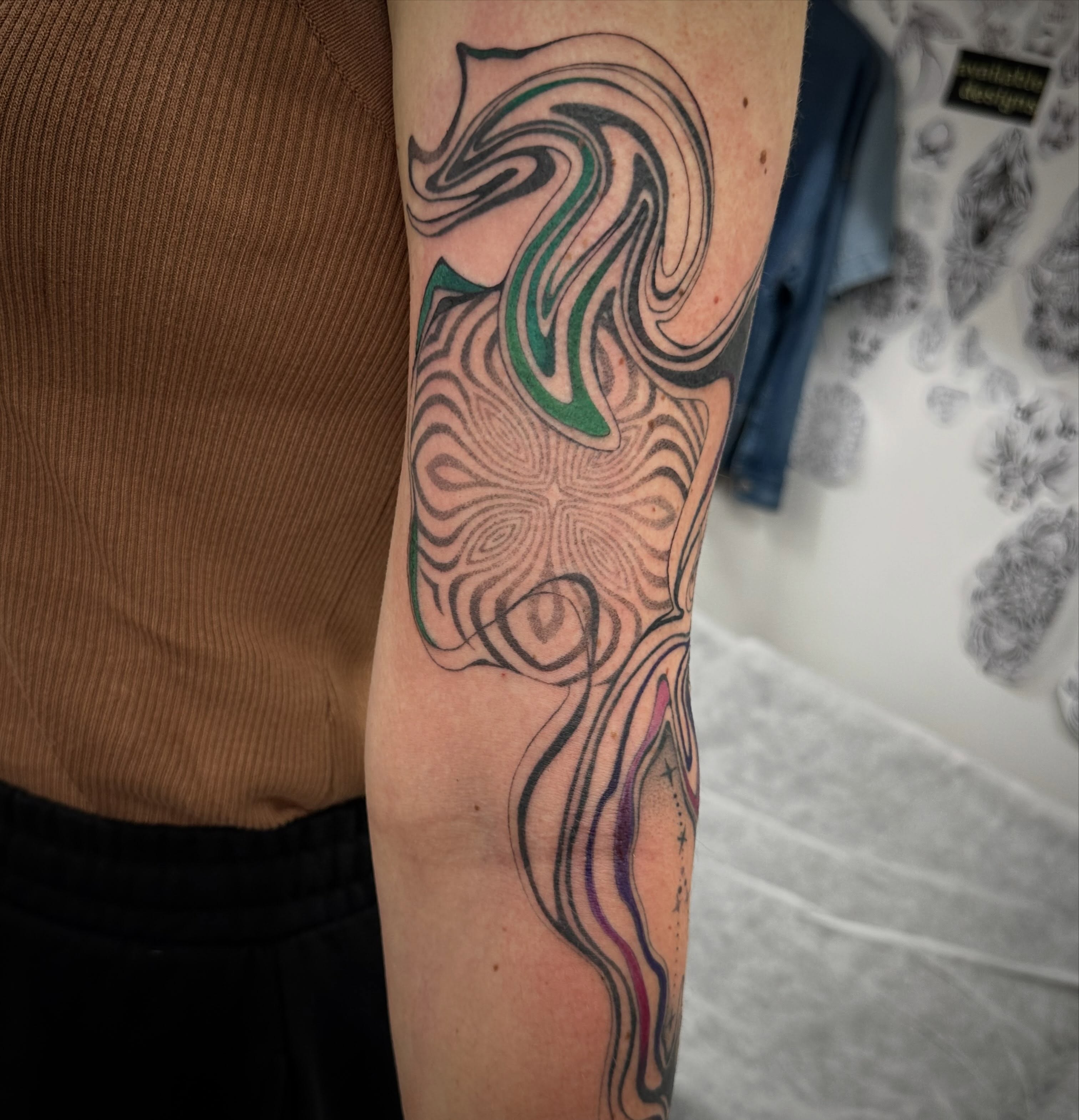 Abstract swirl tattoo on the forearm by Lyndsay Southgate