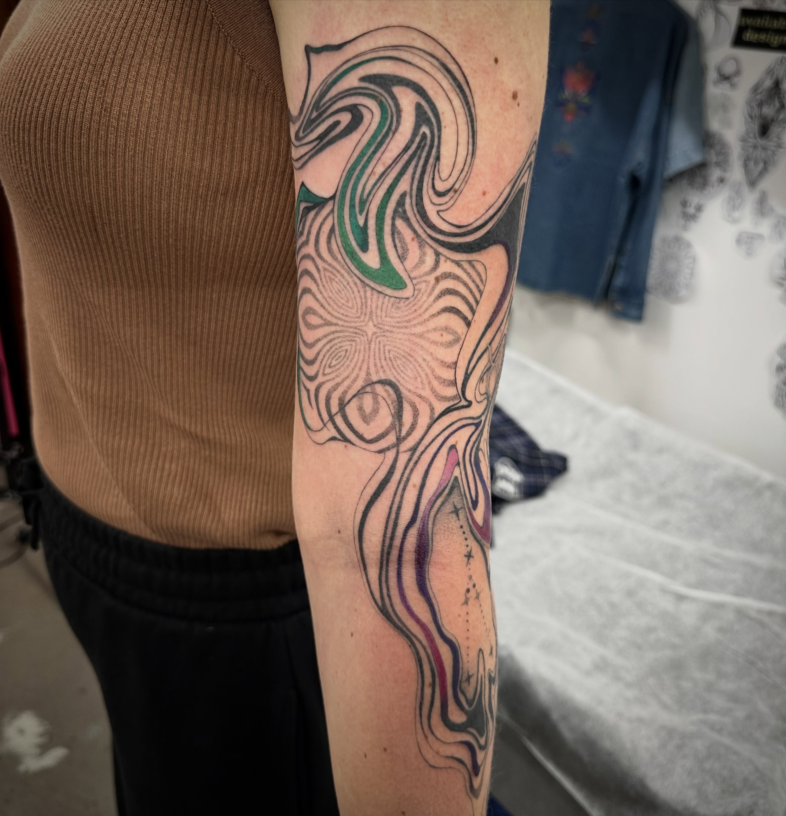 Abstract swirl dotwork tattoo on the forearm by Lyndsay Southgate