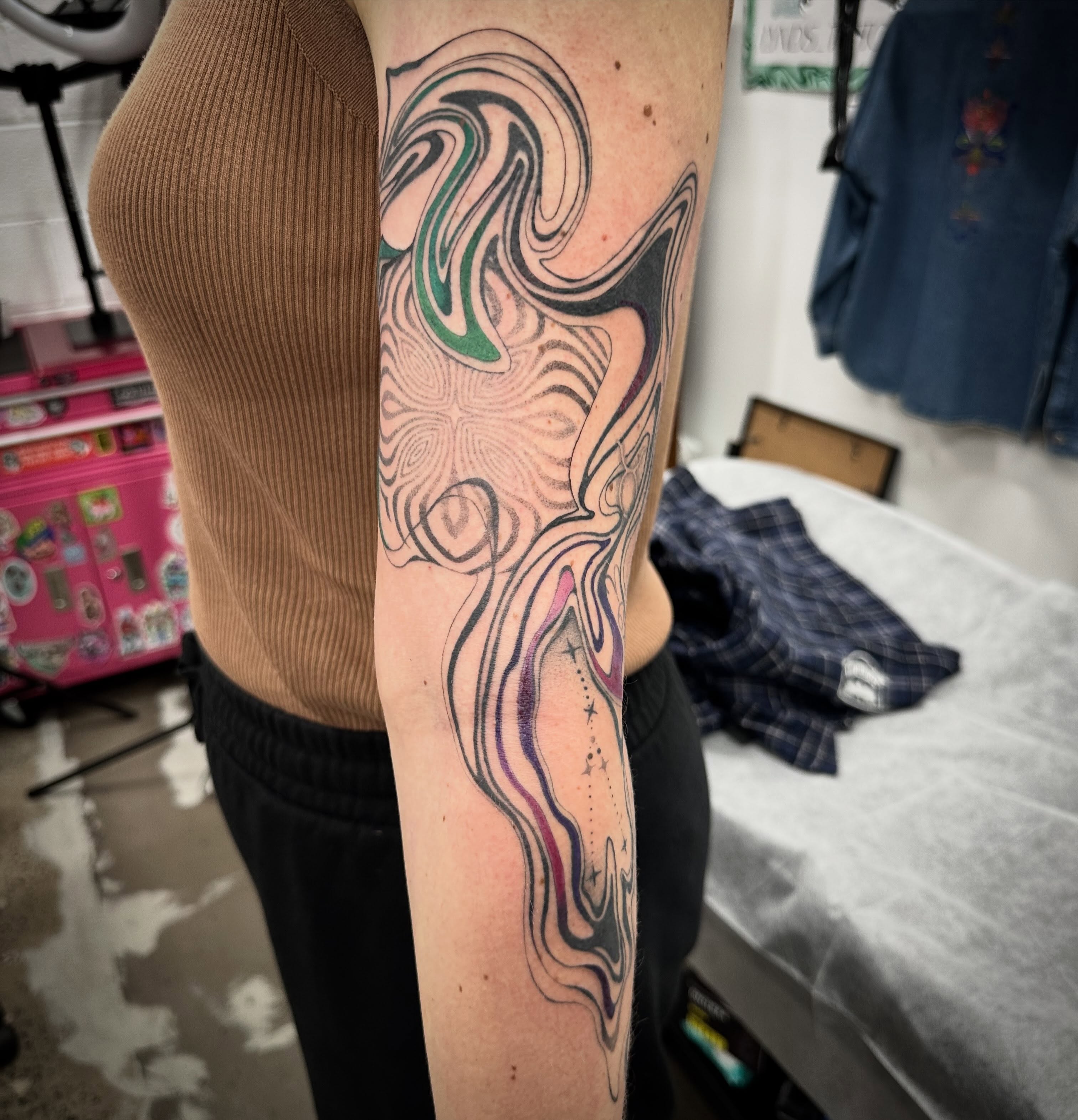 Abstract swirls dotwork tattoo on the forearm by Lyndsay Southgate