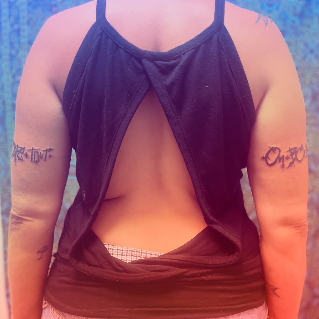 Script lettering lettering script tattoo on the upper arm by La Main Bleue