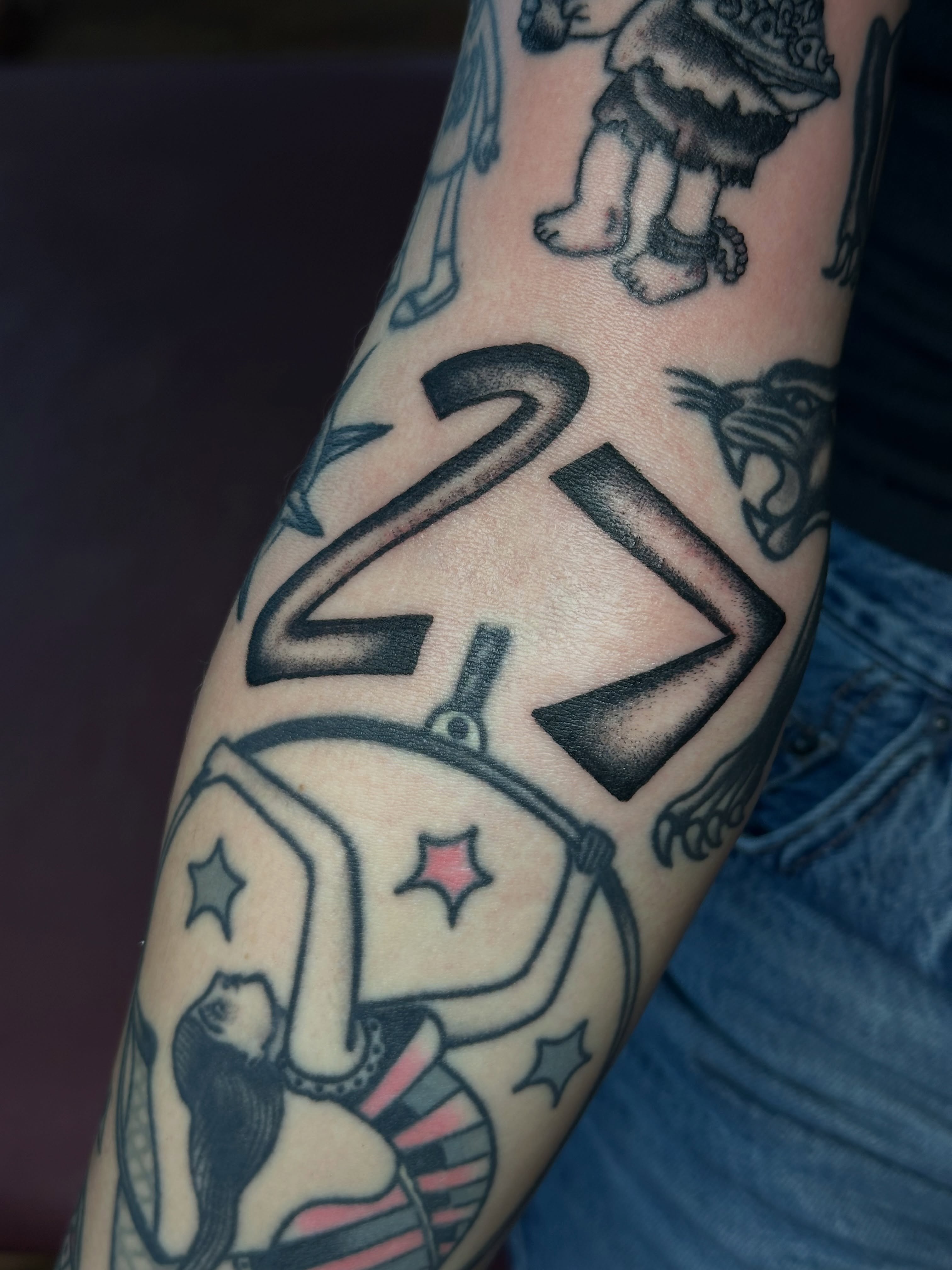 Number 21 American traditional tattoo on the forearm by Providence Tattooer