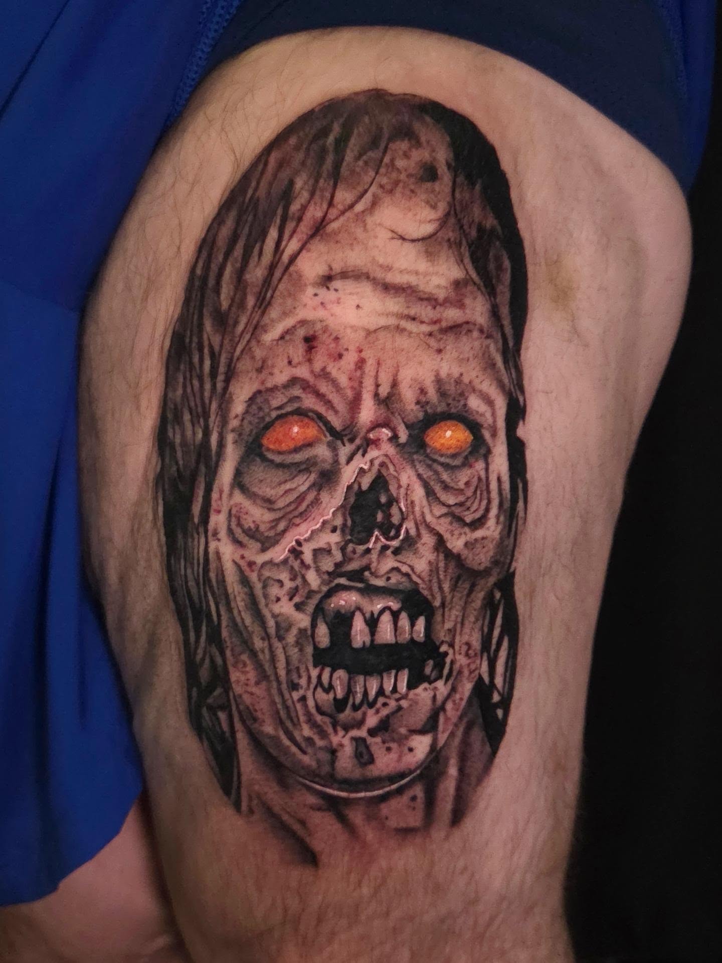 Zombie head realism tattoo on the thigh by Maya Neideck