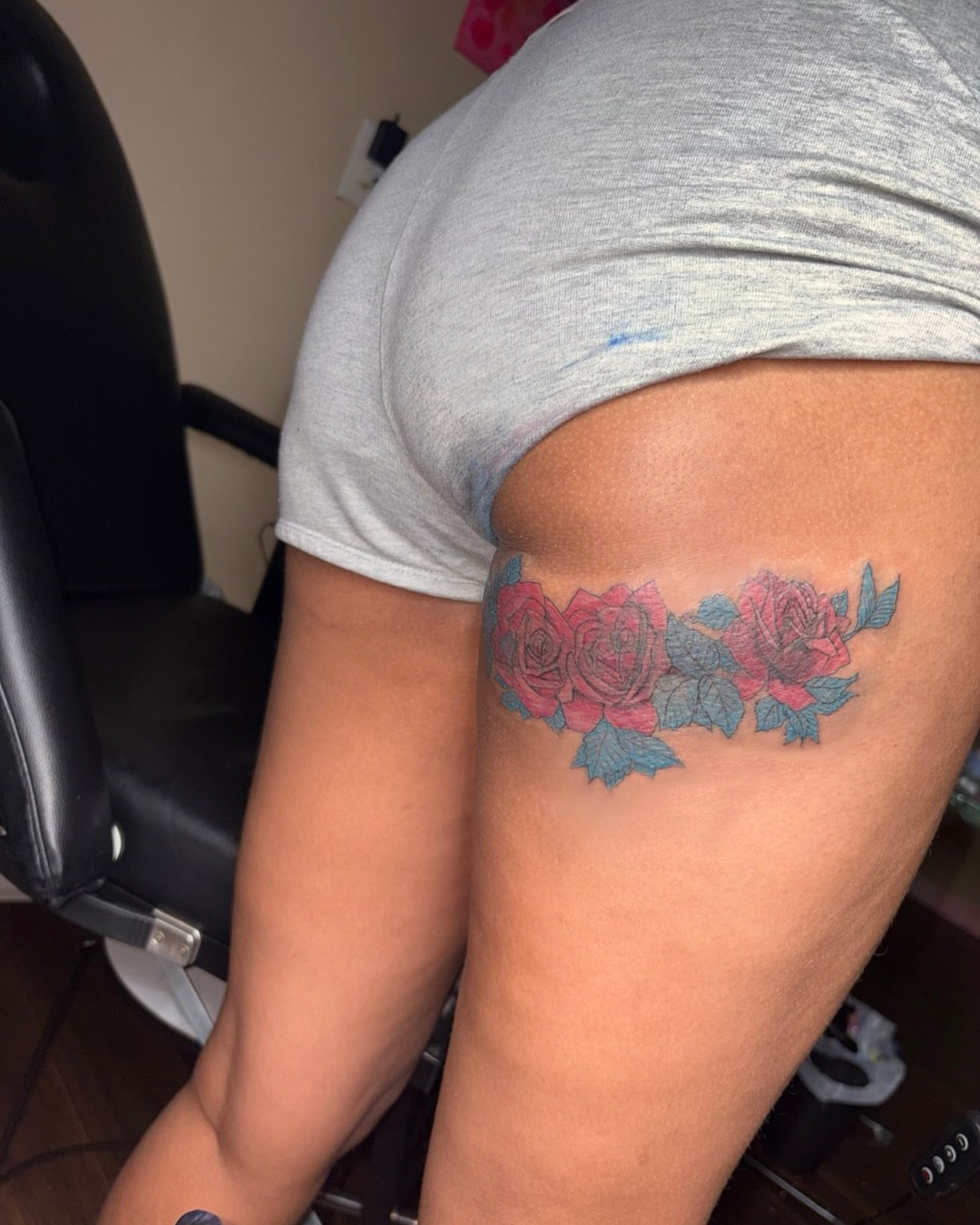 Roses American traditional tattoo on the thigh by K.L Tattoo Uptown
