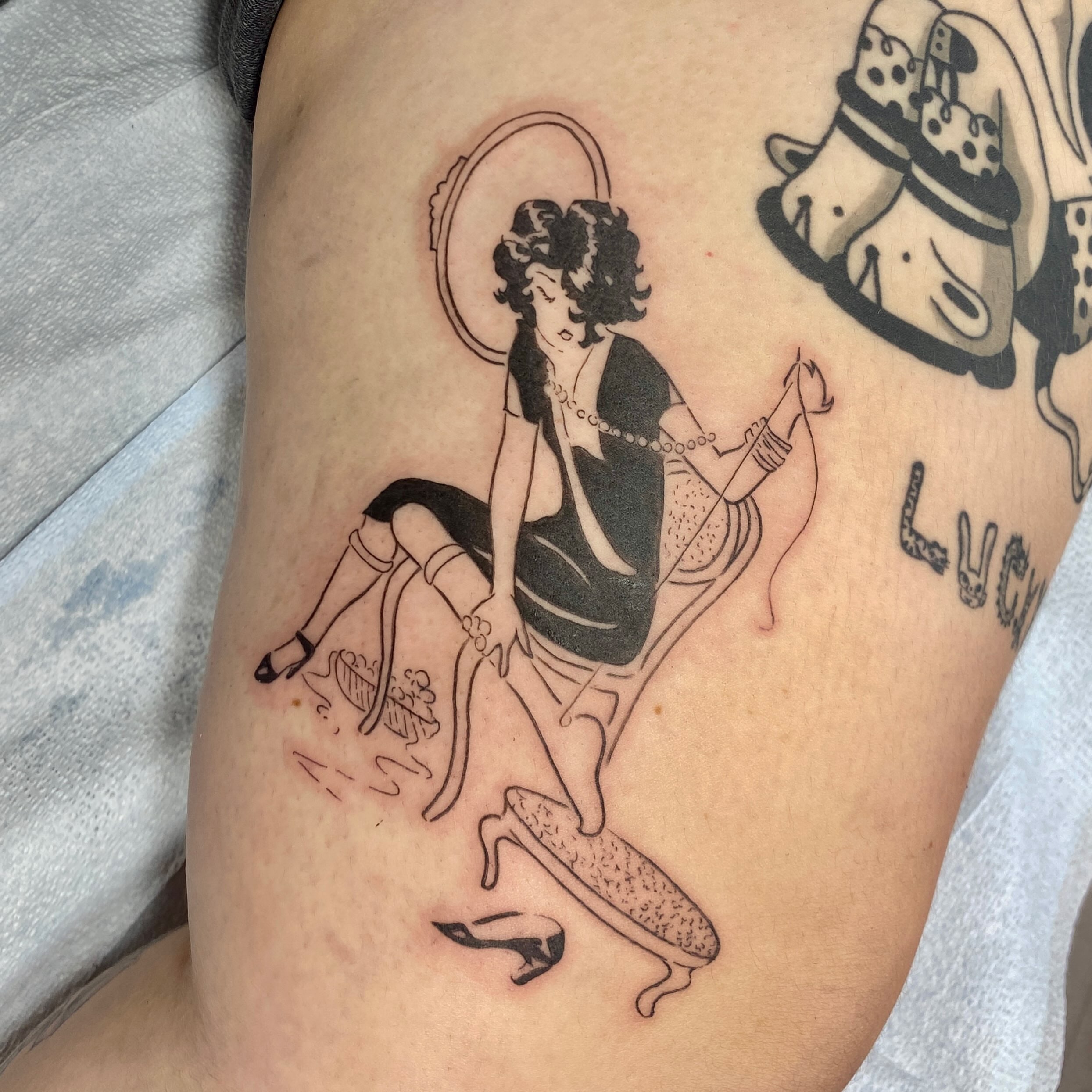 Woman with halo black and grey tattoo on the thigh by °₊⊹ delia ✩ jane ೃ࿔*
