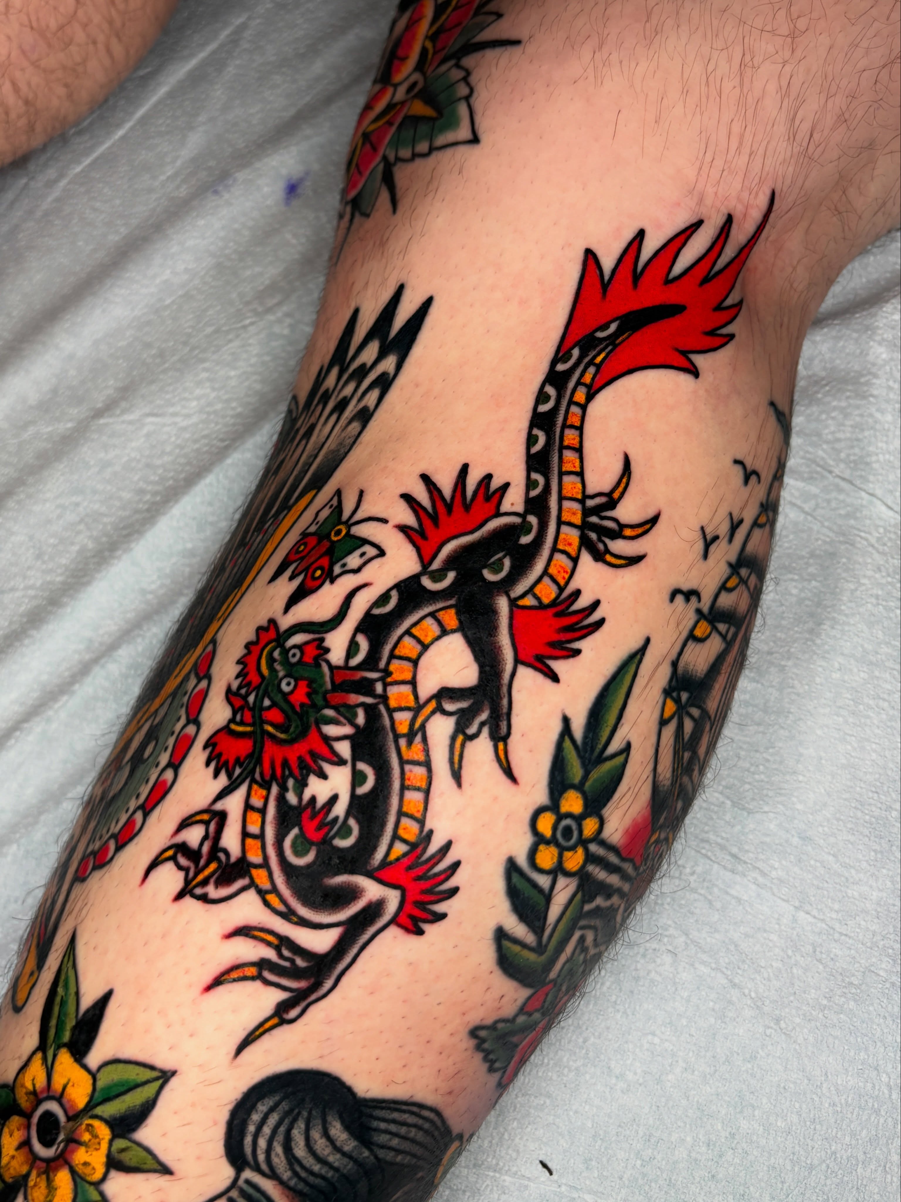 Rooster and floral American traditional tattoo on the forearm by Max Klapp, Austin, Texas