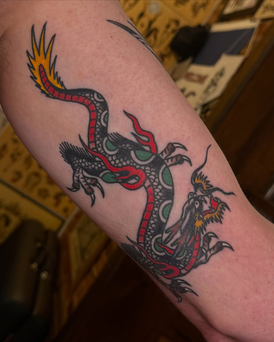 Dragon American traditional tattoo on the forearm by Justin Rakowski