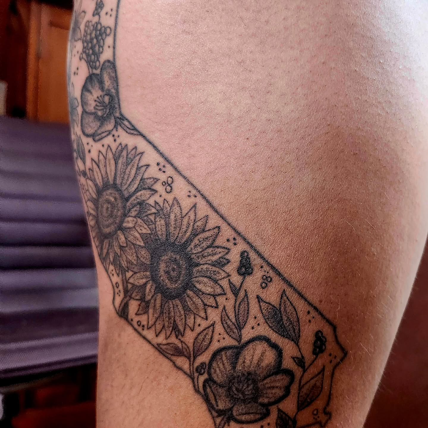 Sunflowers and floral patterns black and grey tattoo on the forearm by @rockinr33d.tattoos