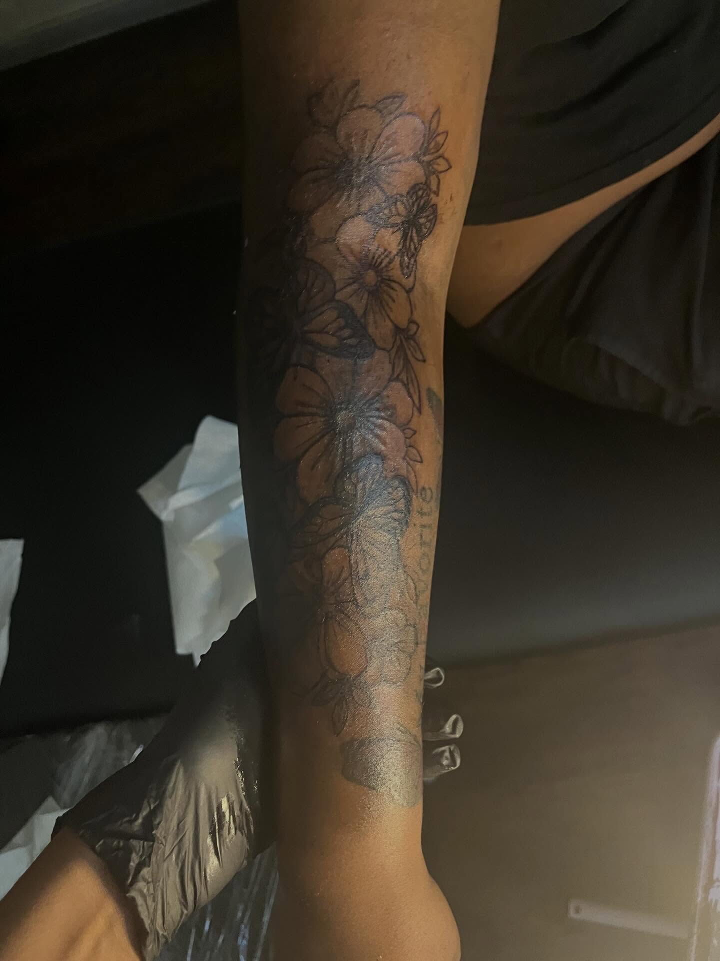 Floral arrangement black and grey tattoo on the forearm by π Westside