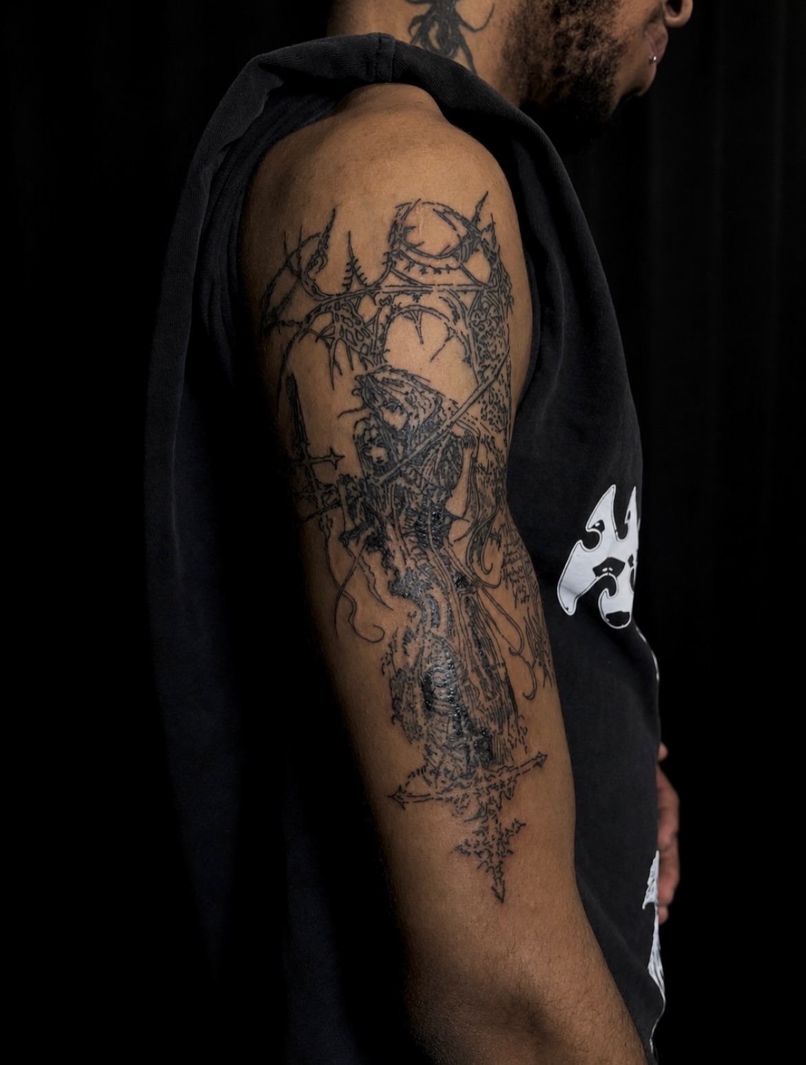 Religious figure black and grey tattoo on the forearm by ɴᴏᴍᴢ ᴅʏsᴇᴍʙᴏᴅɪᴍᴇɴᴛ