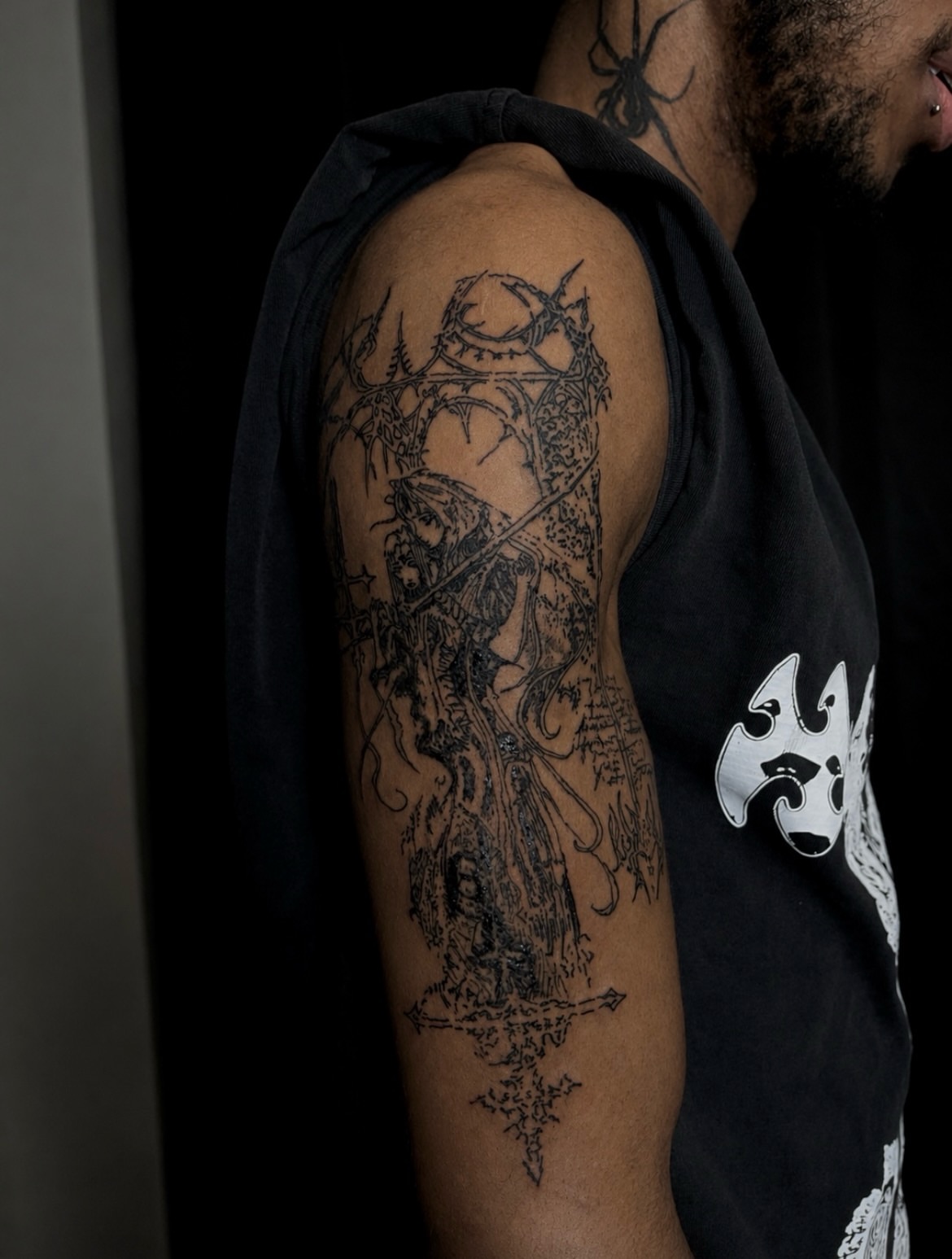 Warrior with sword dark realism tattoo on the upper arm by ɴᴏᴍᴢ ᴅʏsᴇᴍʙᴏᴅɪᴍᴇɴᴛ