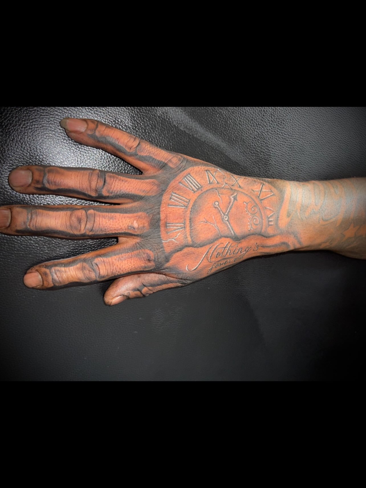 Clock and script black and grey tattoo on the hand by Tu SanchoTattoos
