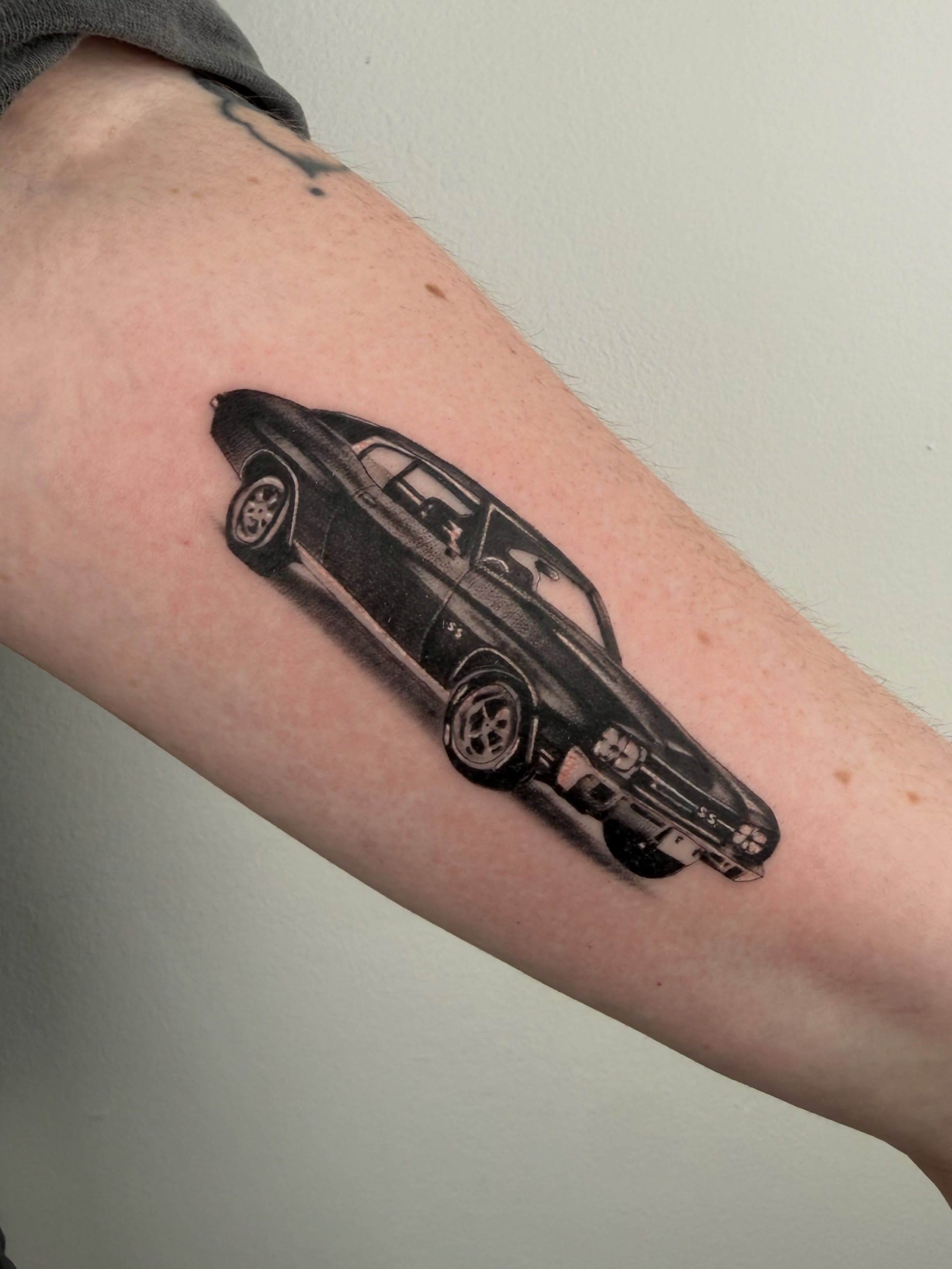 Classic muscle car black and grey tattoo on the forearm by ⊹ ࣪ ₊✩‧₊˚ 𝖘 𝖙 𝖊 𝖕 𝖍 𝖆 𝖓 𝖎 𝖊 ˚₊‧✩₊ ࣪ ⊹