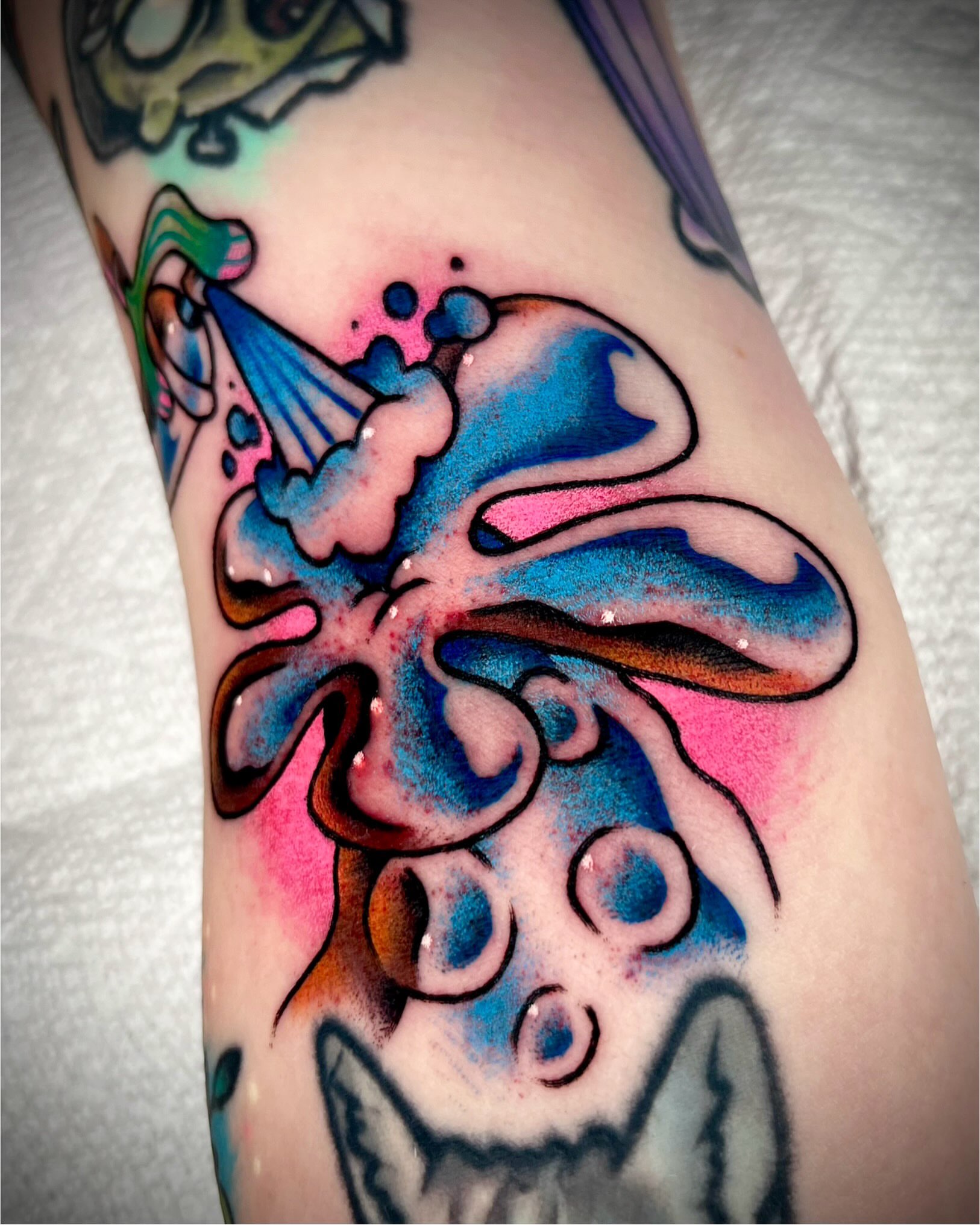 Octopus new school tattoo on the forearm by Zach Knisley (Wiz)
