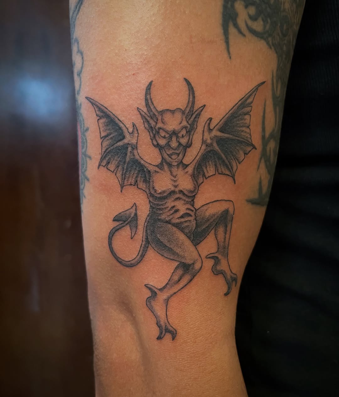 Gargoyle black and grey tattoo on the forearm by Campbell Zane Alexander