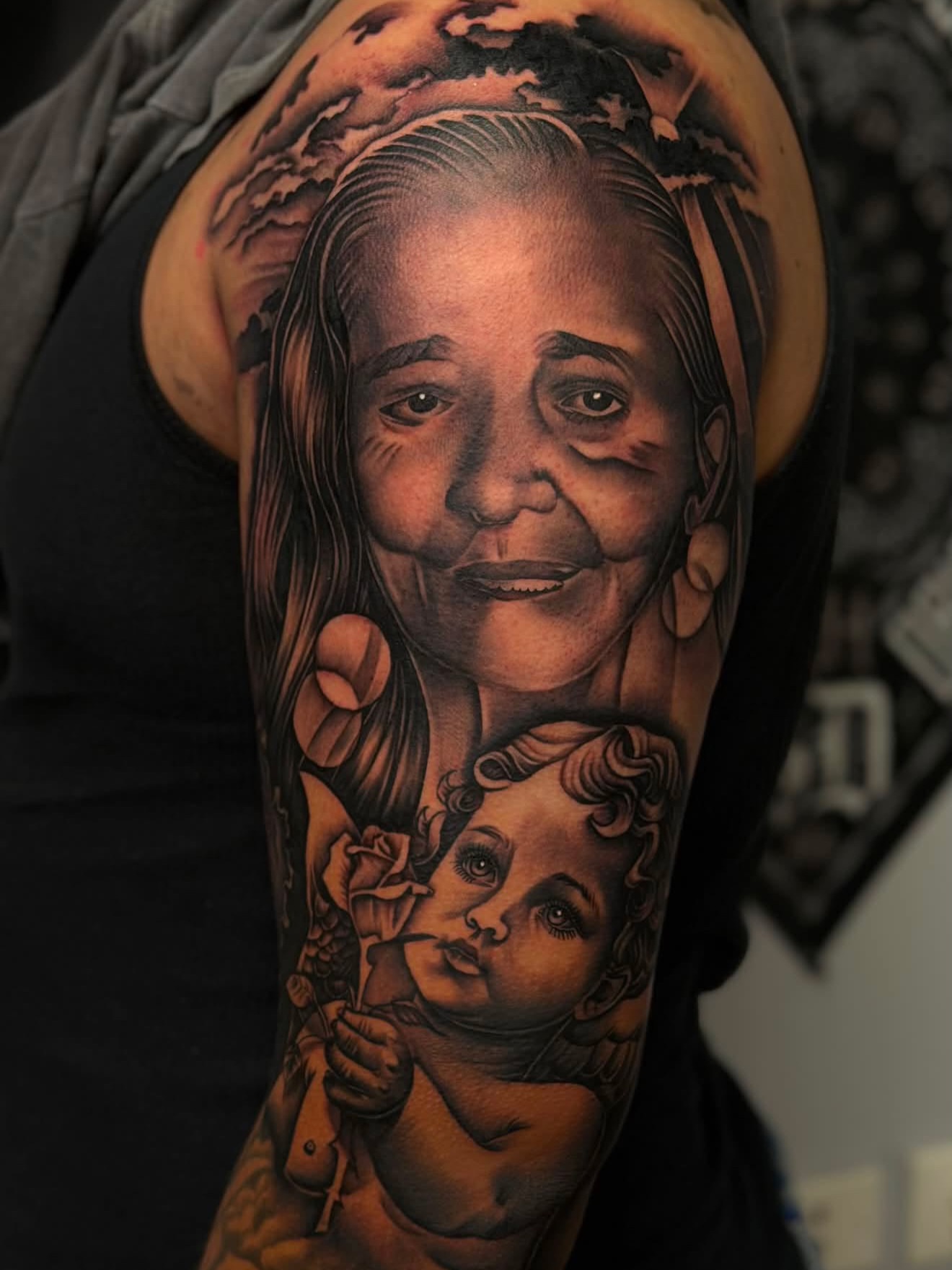 Grandmother and child realism tattoo on the forearm by San Diego Tattoo Artist
