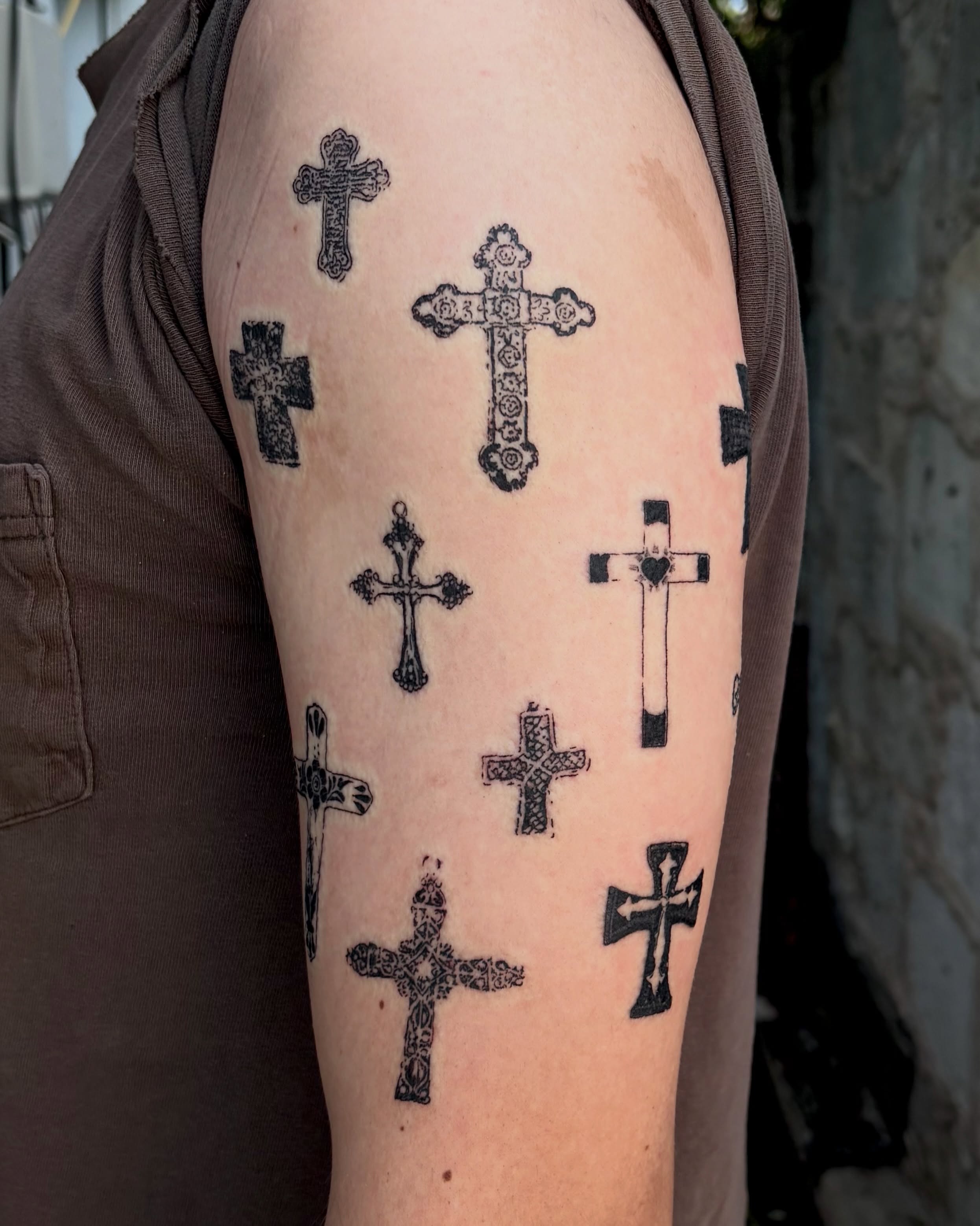 Crosses black and grey tattoo on the forearm by Kylah Amin Tattoo
