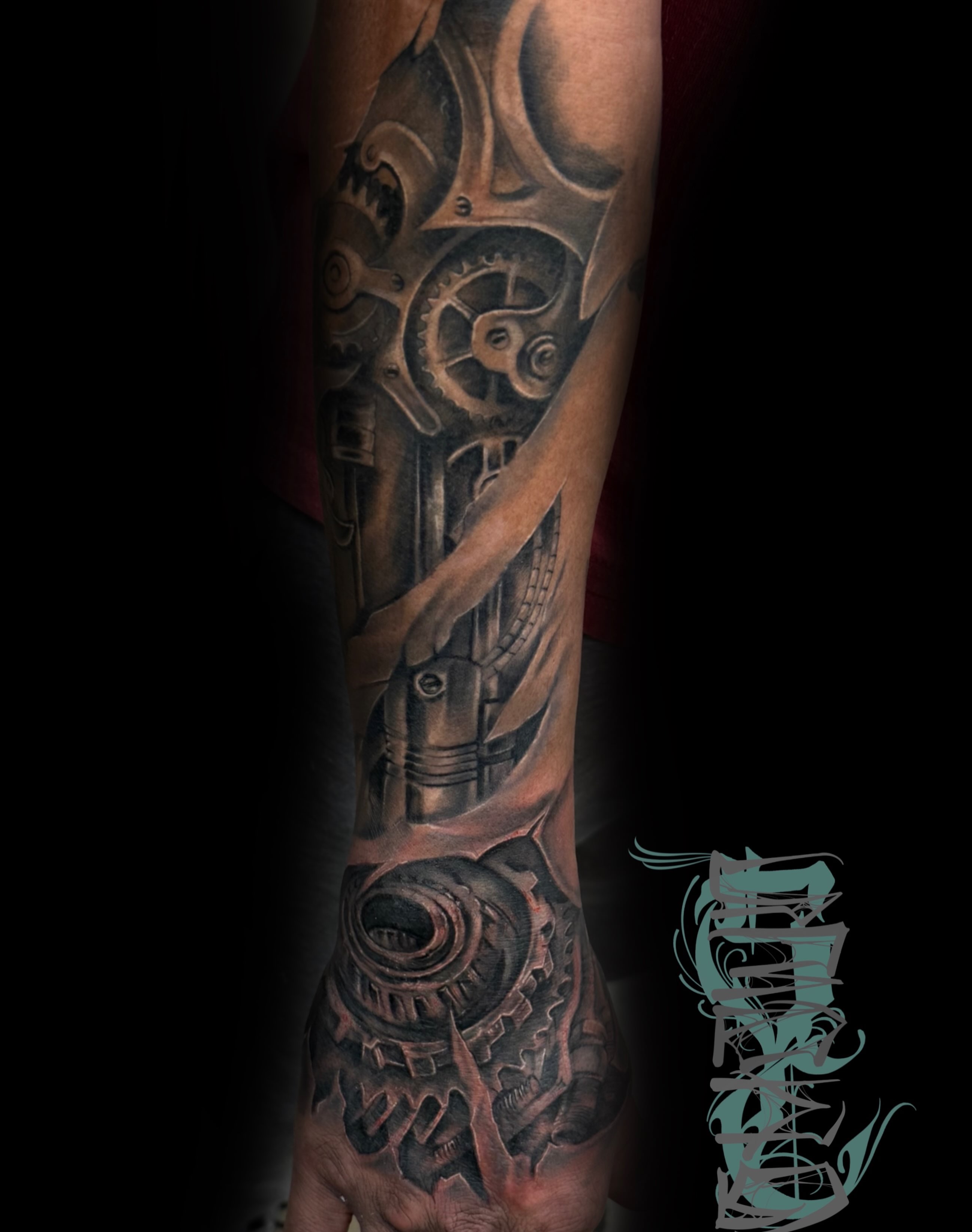 Mechanical gears geometric tattoo on the forearm by Shawn Cook