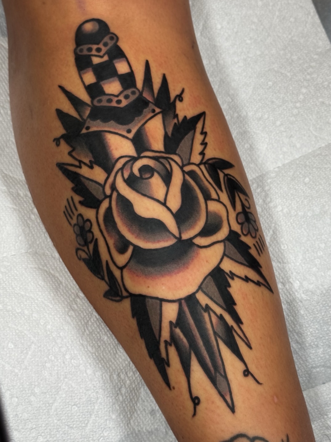 Rose with crown American traditional tattoo on the forearm by JoJo Benton