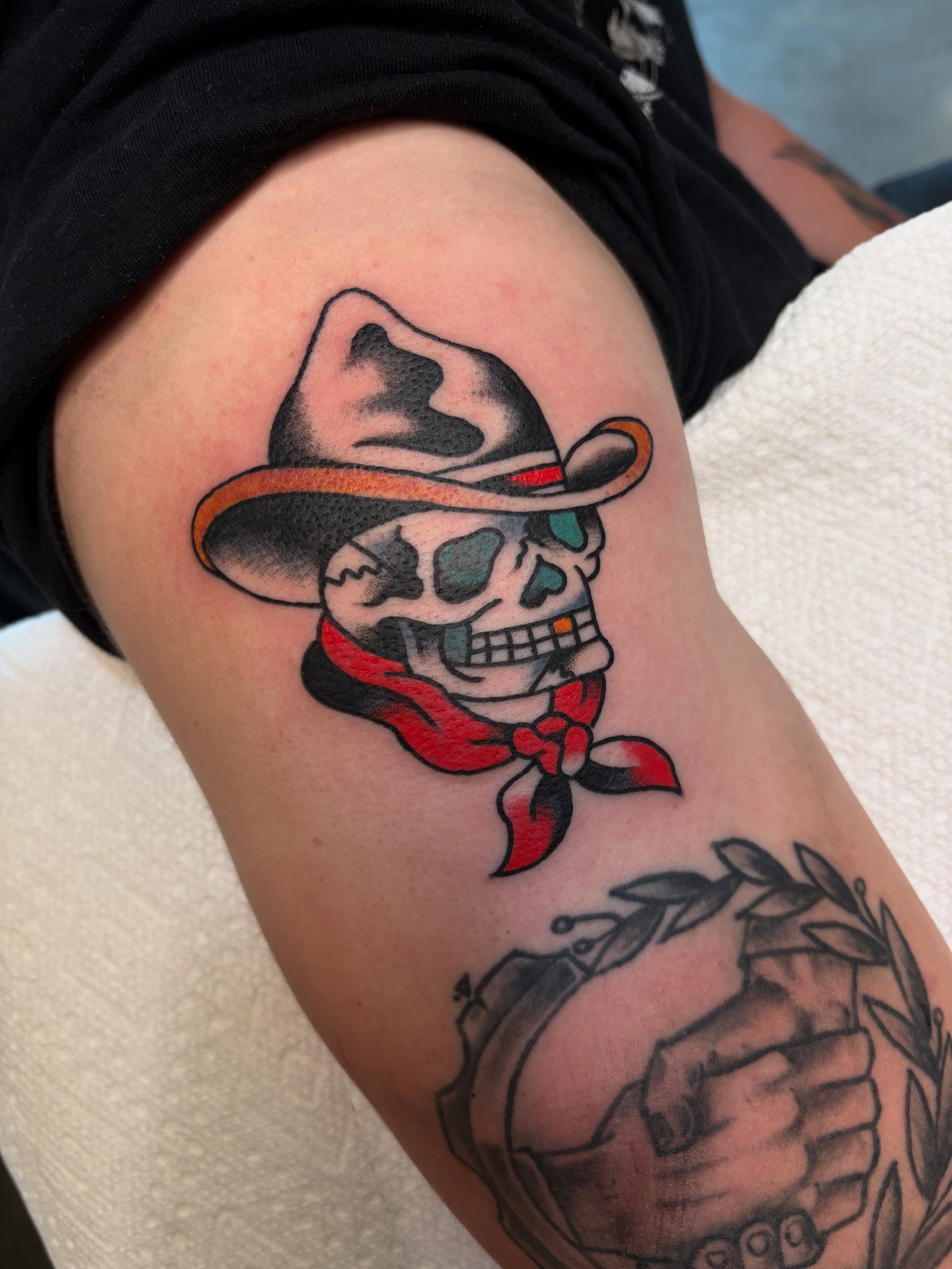 Cowboy skull American traditional tattoo on the thigh by Sammy Tattoo, Austin, Texas