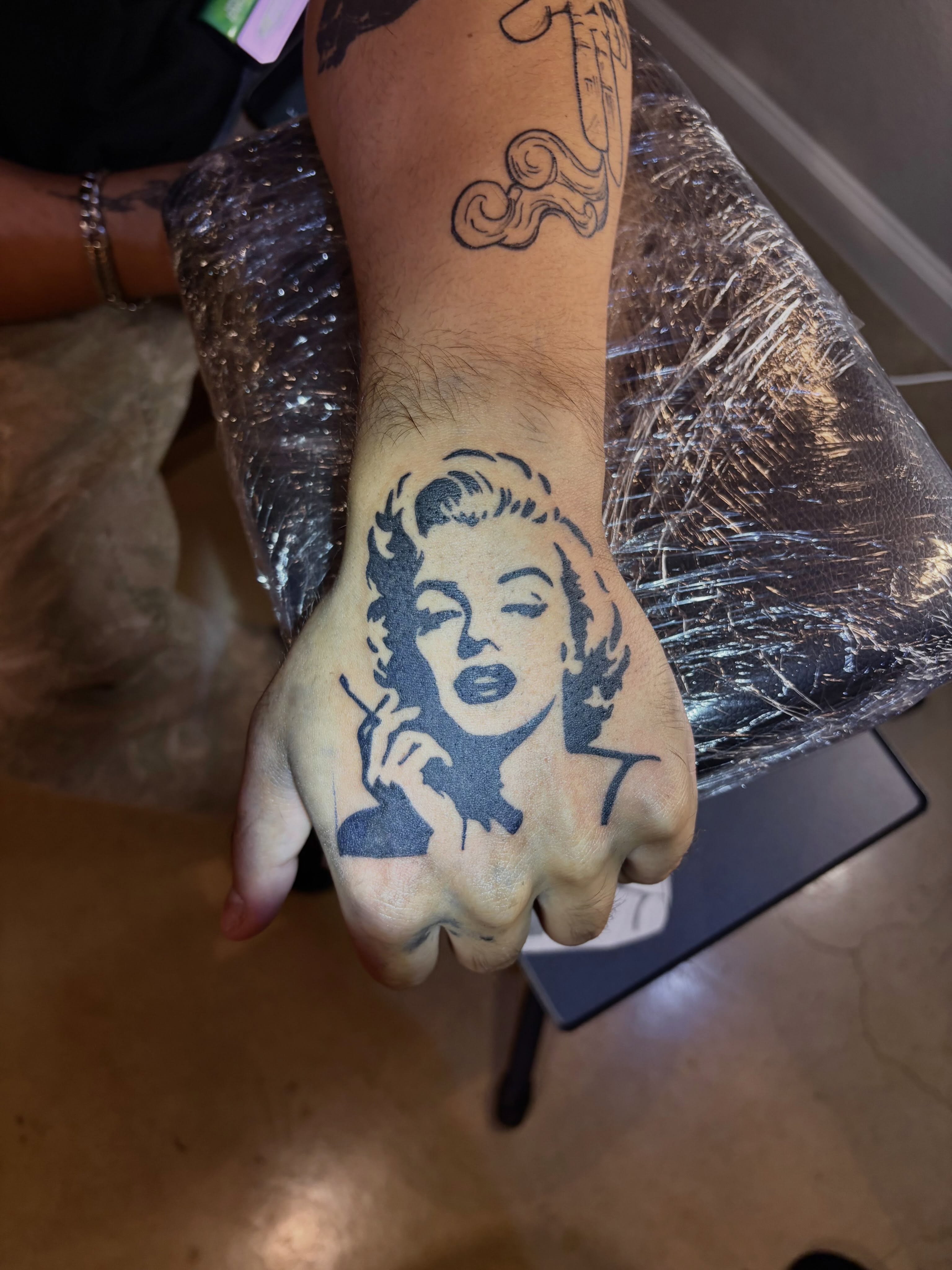 Marilyn monroe black and grey tattoo on the hand by blastedbybk
