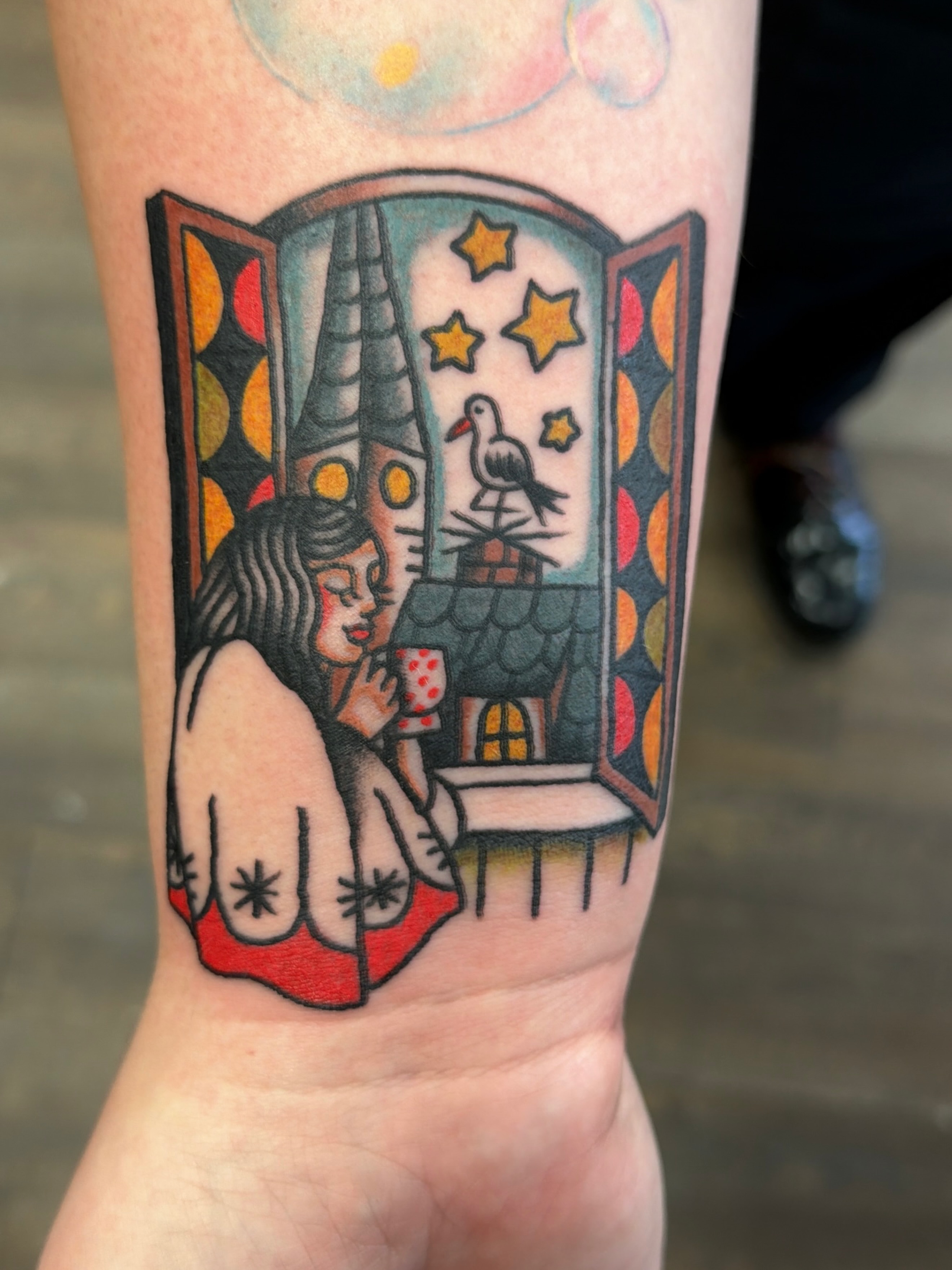 Window scene American traditional tattoo on the forearm by Emma Fox Tattoo